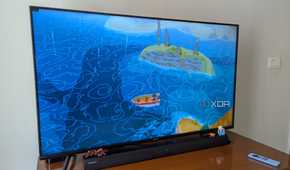 Apple TV running a game on a smart TV using Steam Link