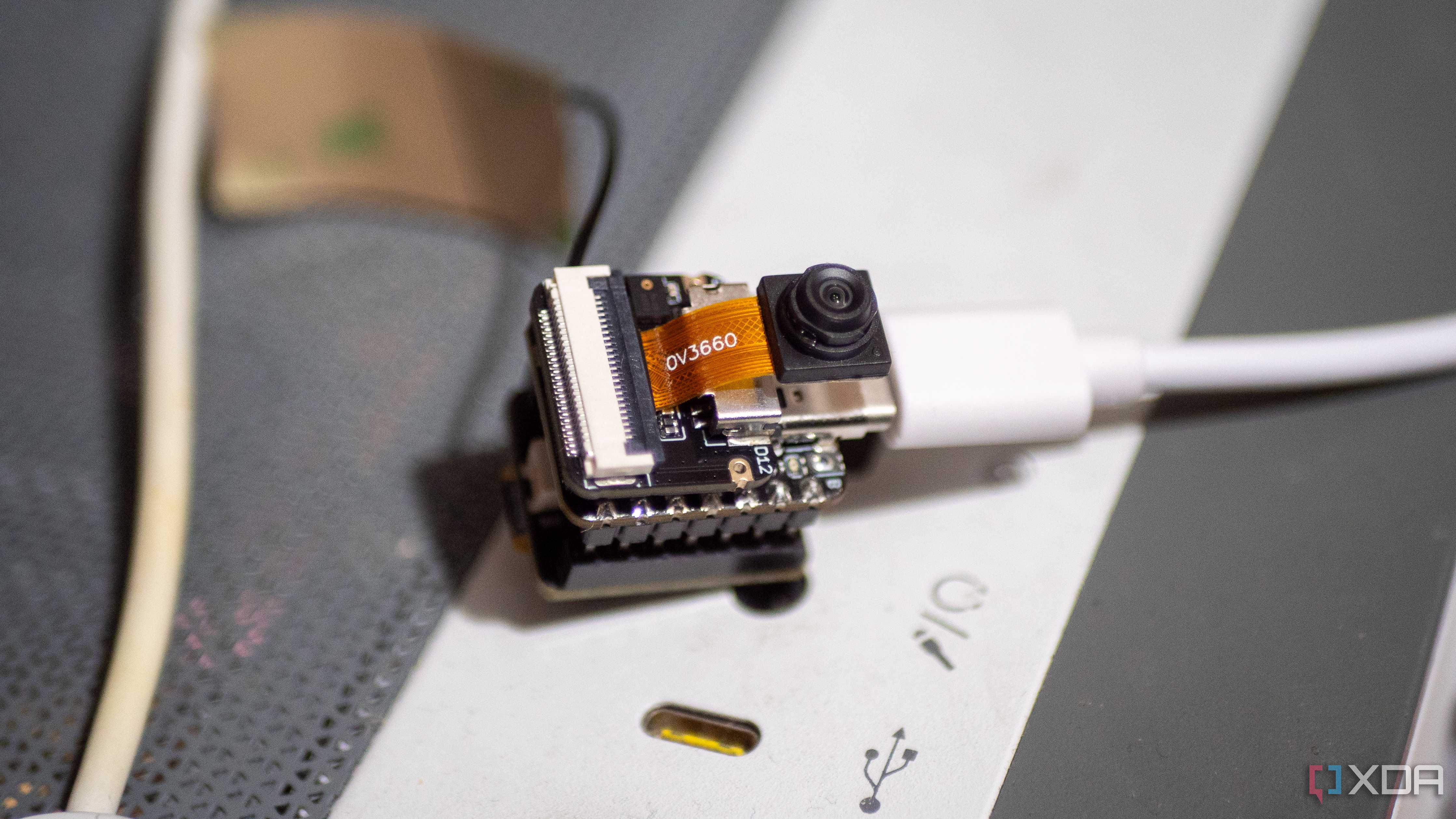 XIAO ESP32 S3 Sense on a PC case, showing Wi-Fi antenna