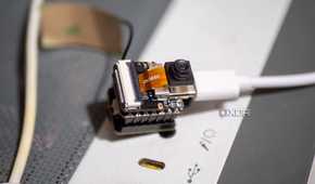 XIAO ESP32 S3 Sense on a PC case, showing Wi-Fi antenna