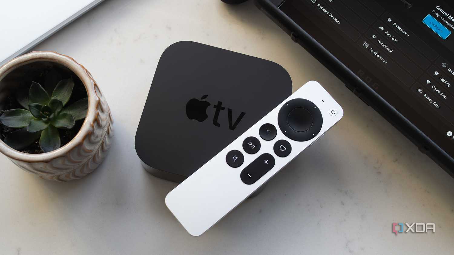 The Apple TV 4K and the Siri Remote sitting on a counter