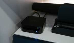 The Apple TV 4K sitting under a TV