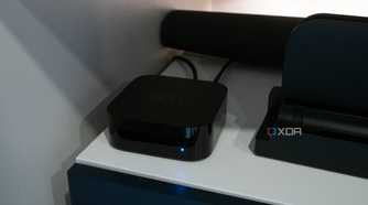 The Apple TV 4K sitting under a TV