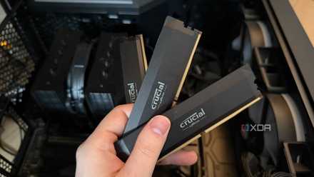 A photo of someone holding 3 sticks of DDR5 RAM