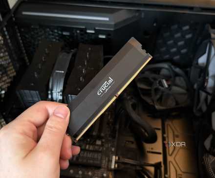 Modern PC hardware failure rates aren't increasing, the expectations are just higher 5 A photo of someone holding a RAM stick in front of a PC with the side panel off