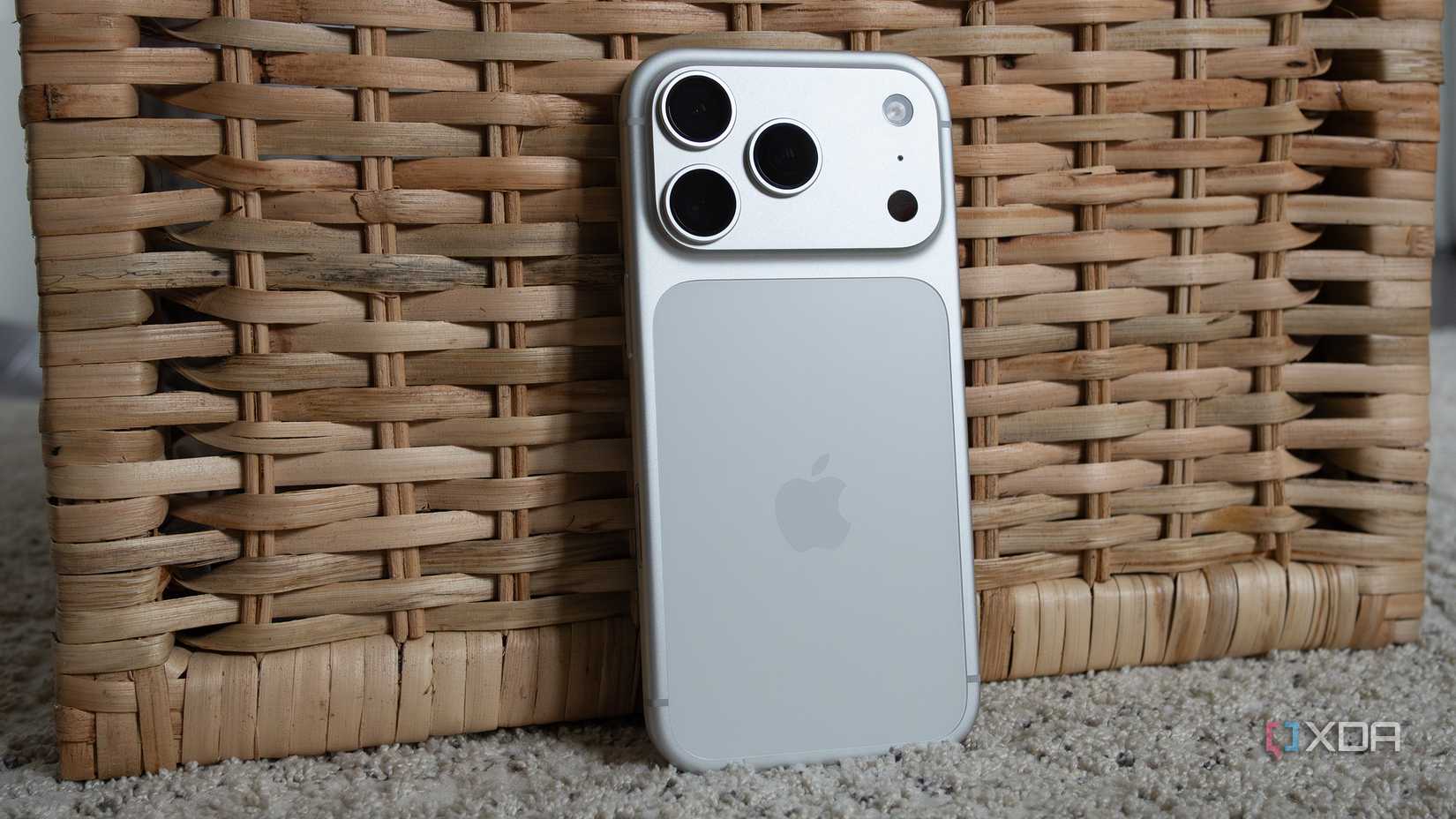 The iPhoen 17 Pro leaning against a basket 