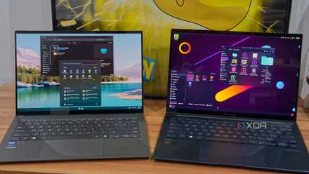 Linux and Windows laptops next to each other showing the desktop and respective file managers