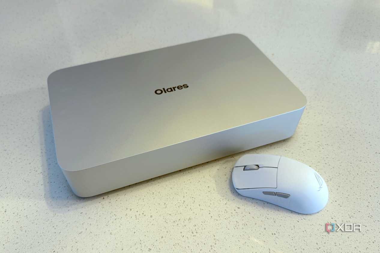 olares one mini PC for AI on a countertop next to a white mouse