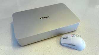 olares one mini PC for AI on a countertop next to a white mouse