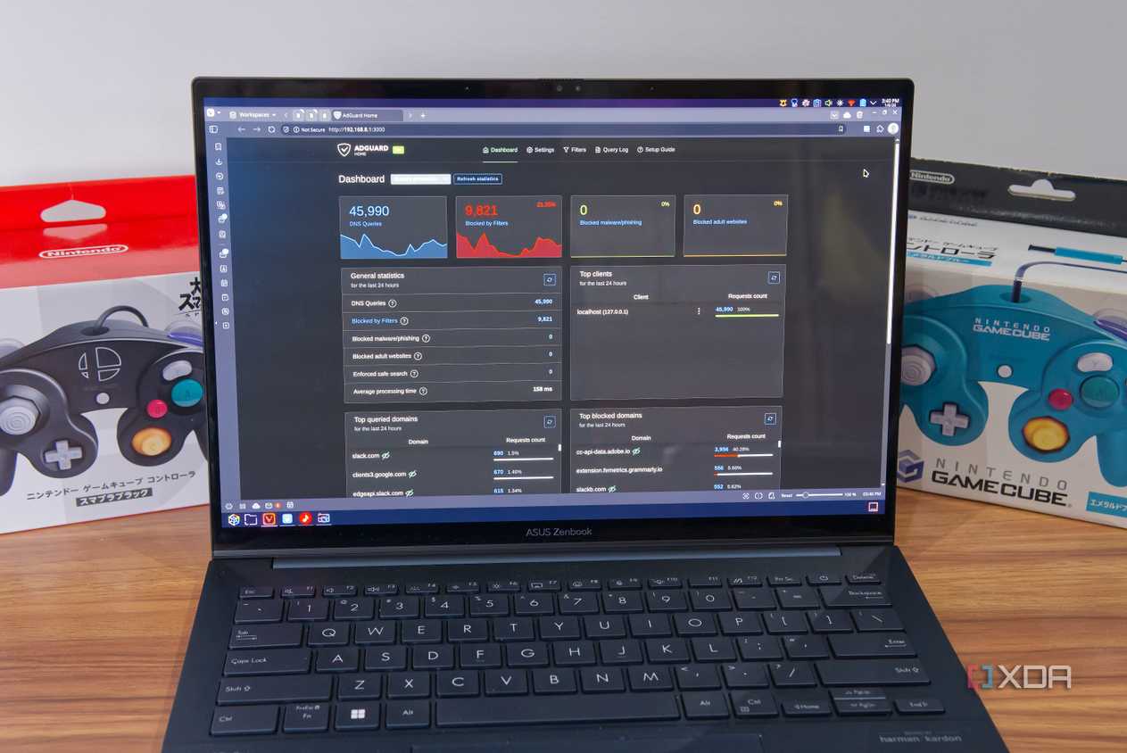 A laptop showing the dashbaord for AdGuard Home in a web browser
