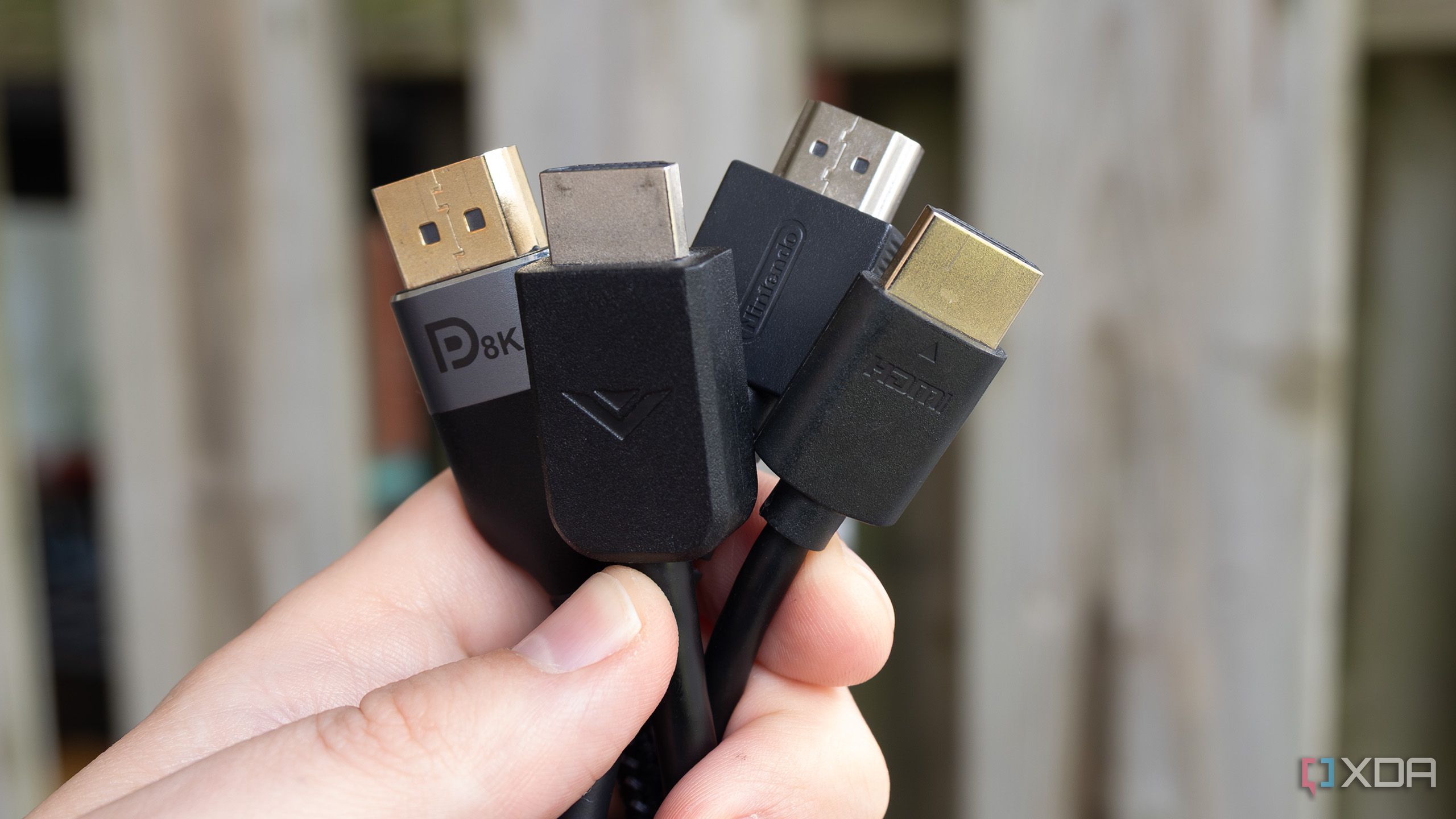Several HDMI cables being held in a bundle
