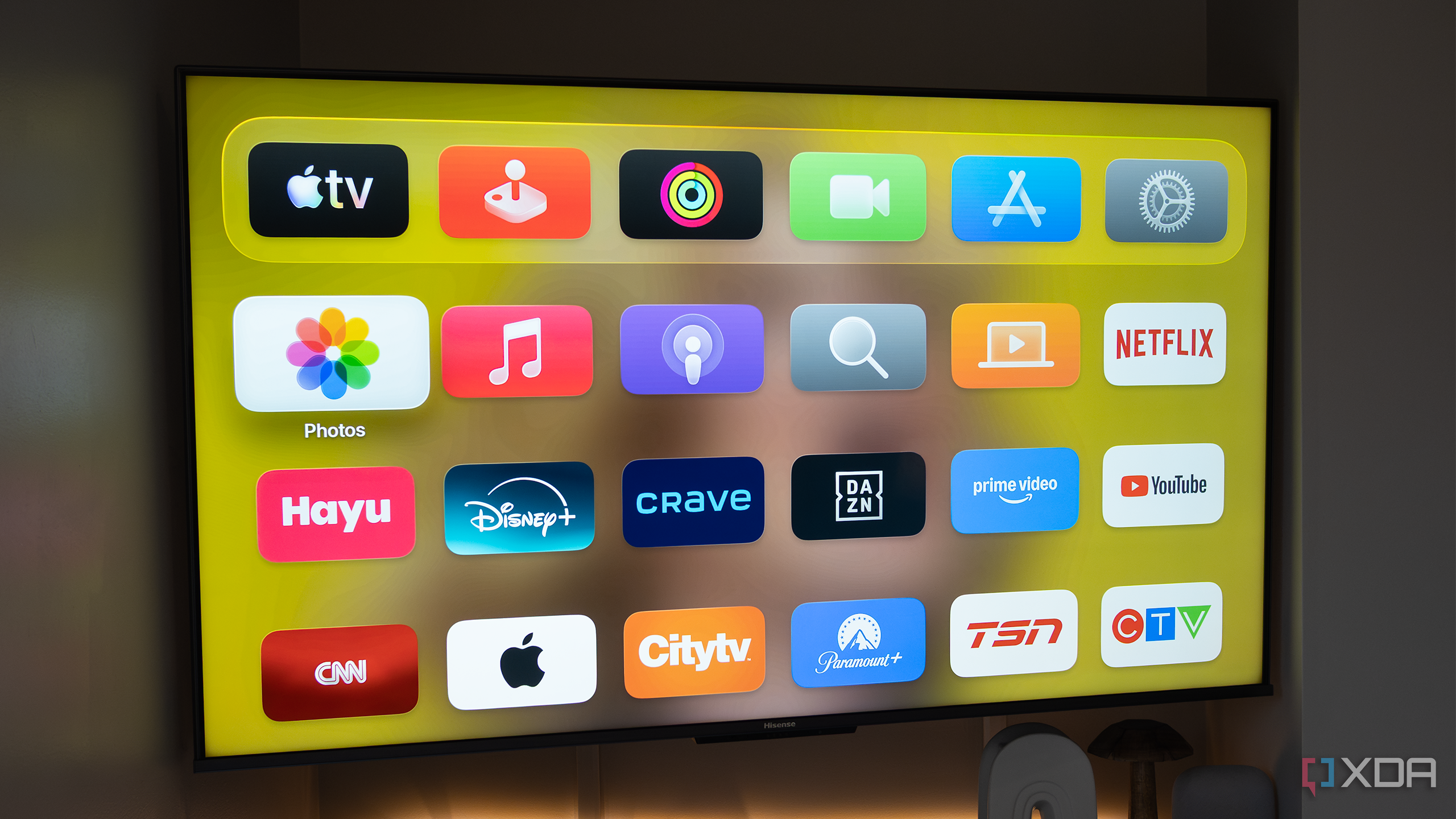 Apple TV home screen in a dark room 