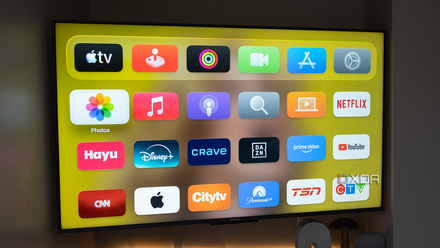 Apple TV home screen in a dark room