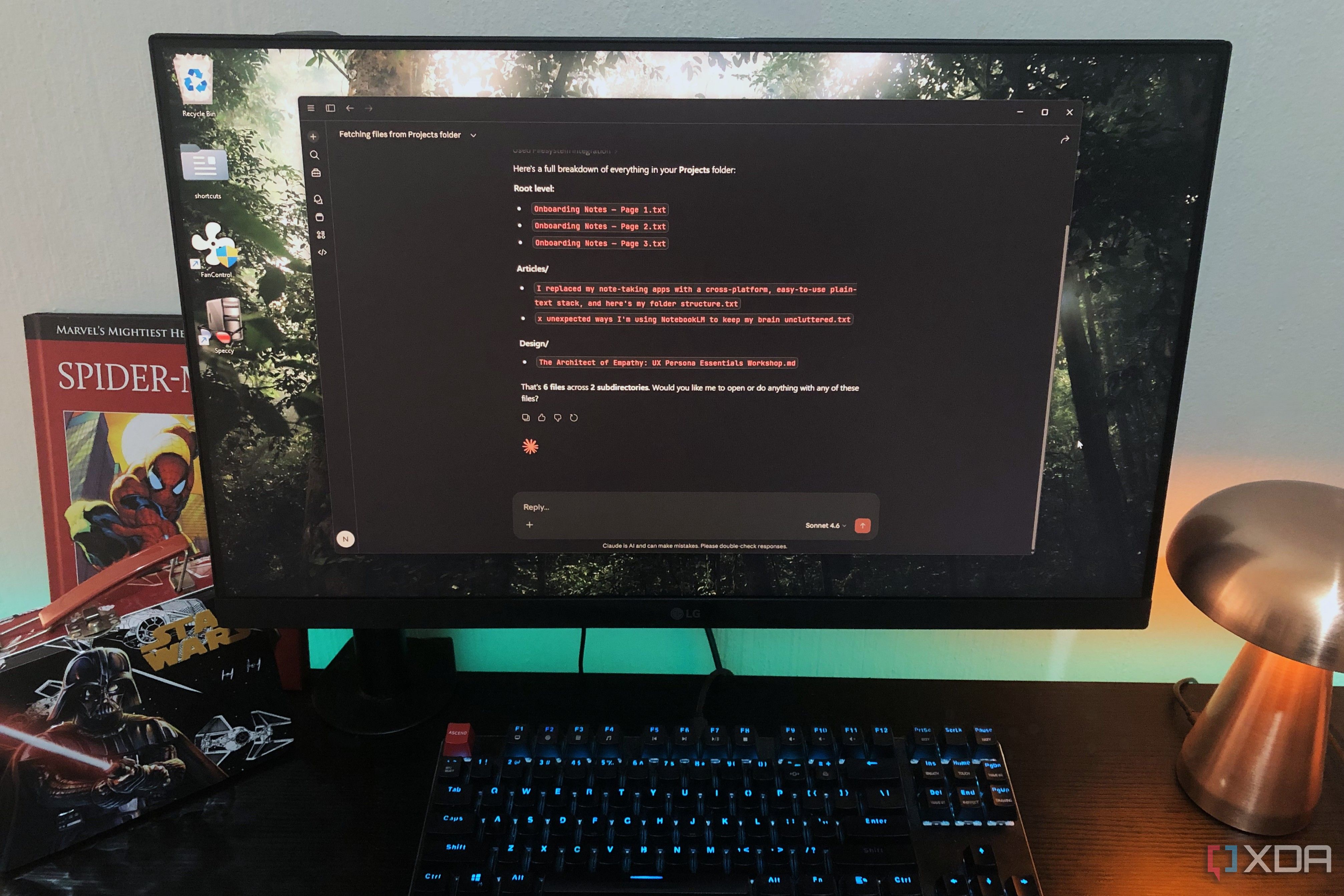 Claude app on desktop pc, lamp and book in view