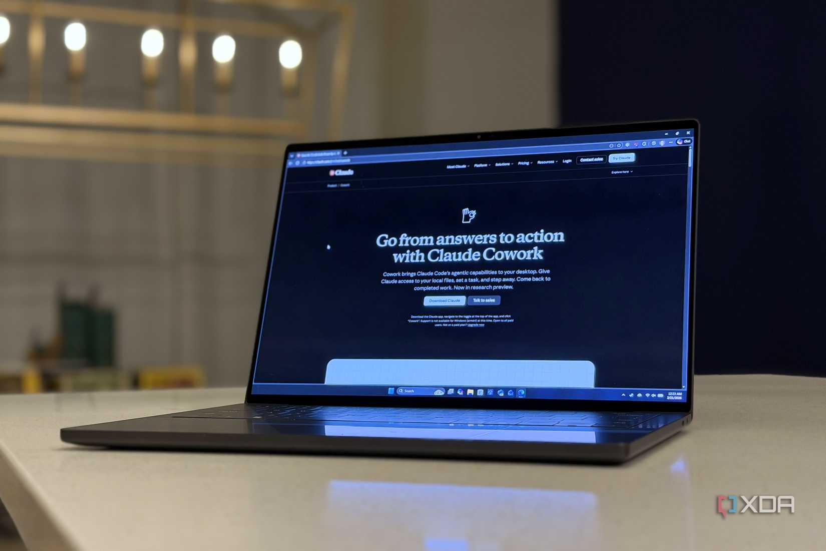 claude cowork website open on a laptop