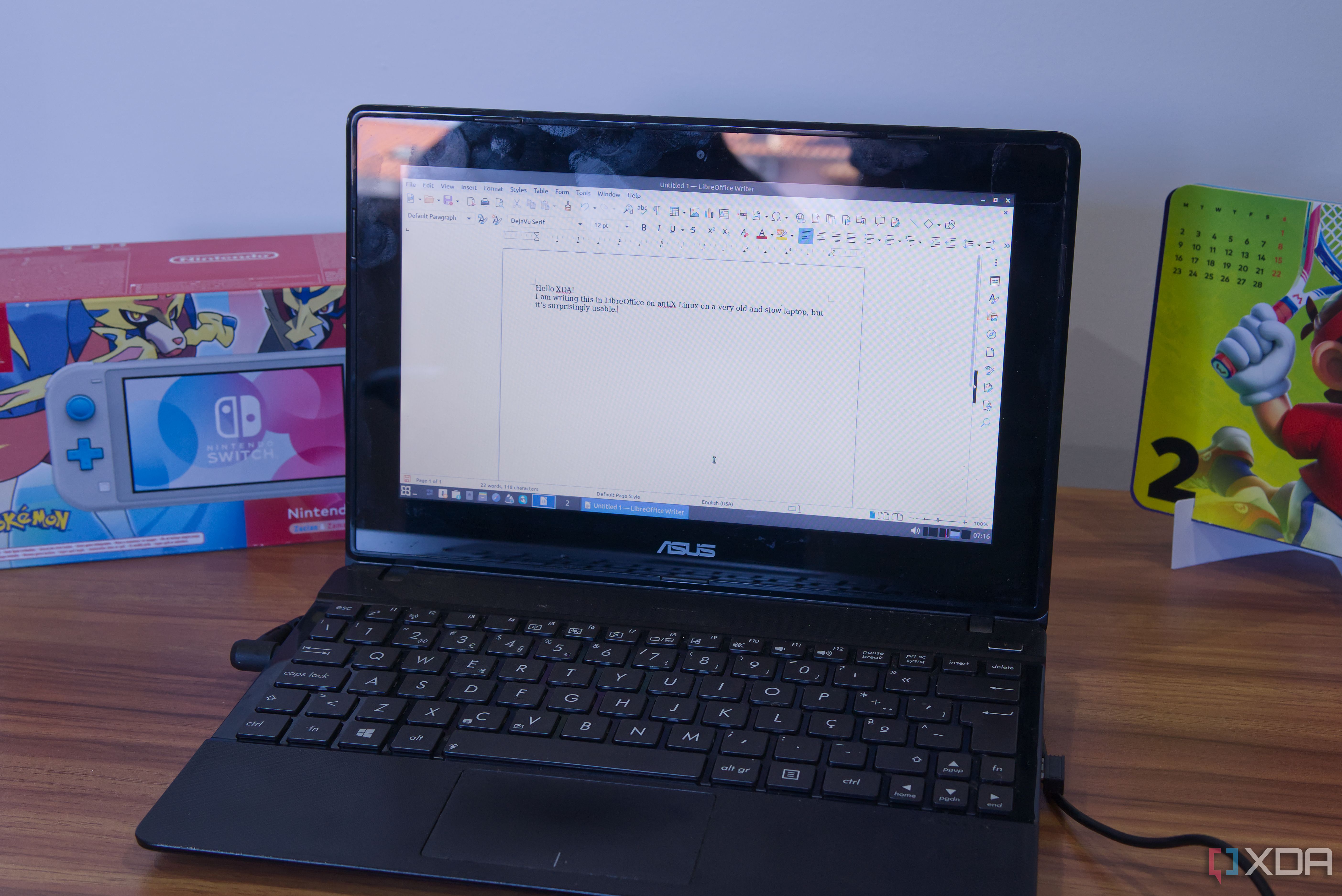 A laptop running LibreOffice Writer on antiX Linux. The document reads 