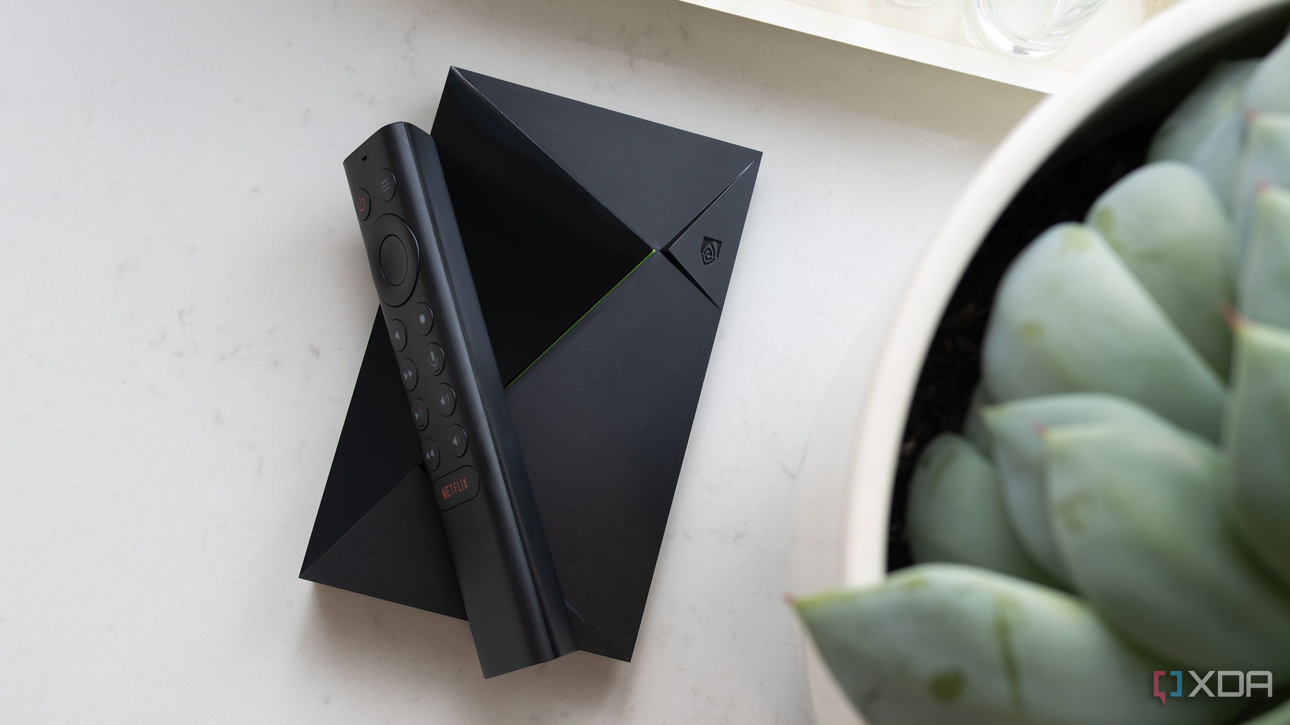 The Nvidia Shield TV Pro with its remote from the top