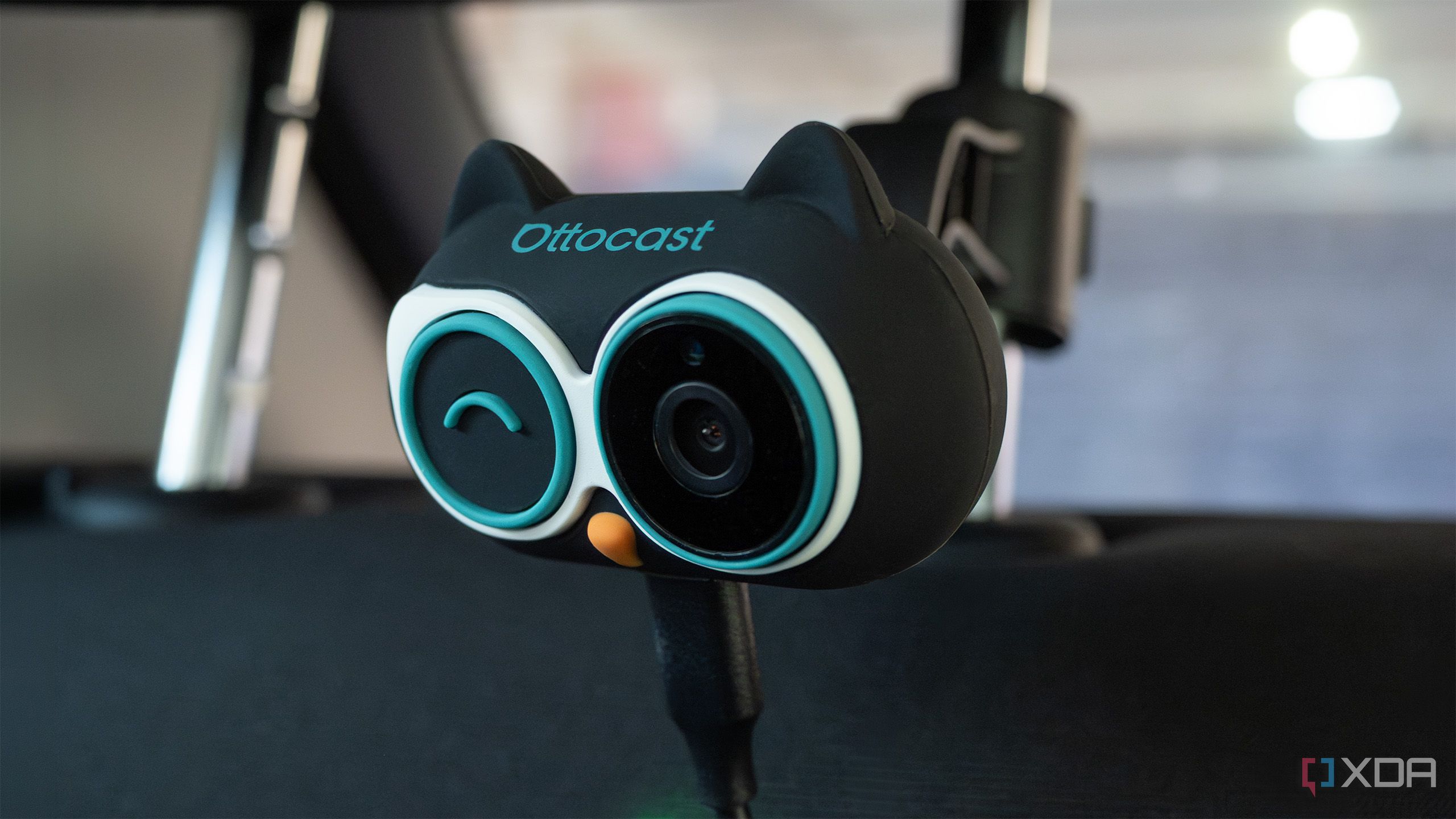 The Ottocast Car Care attached to a headrest rail