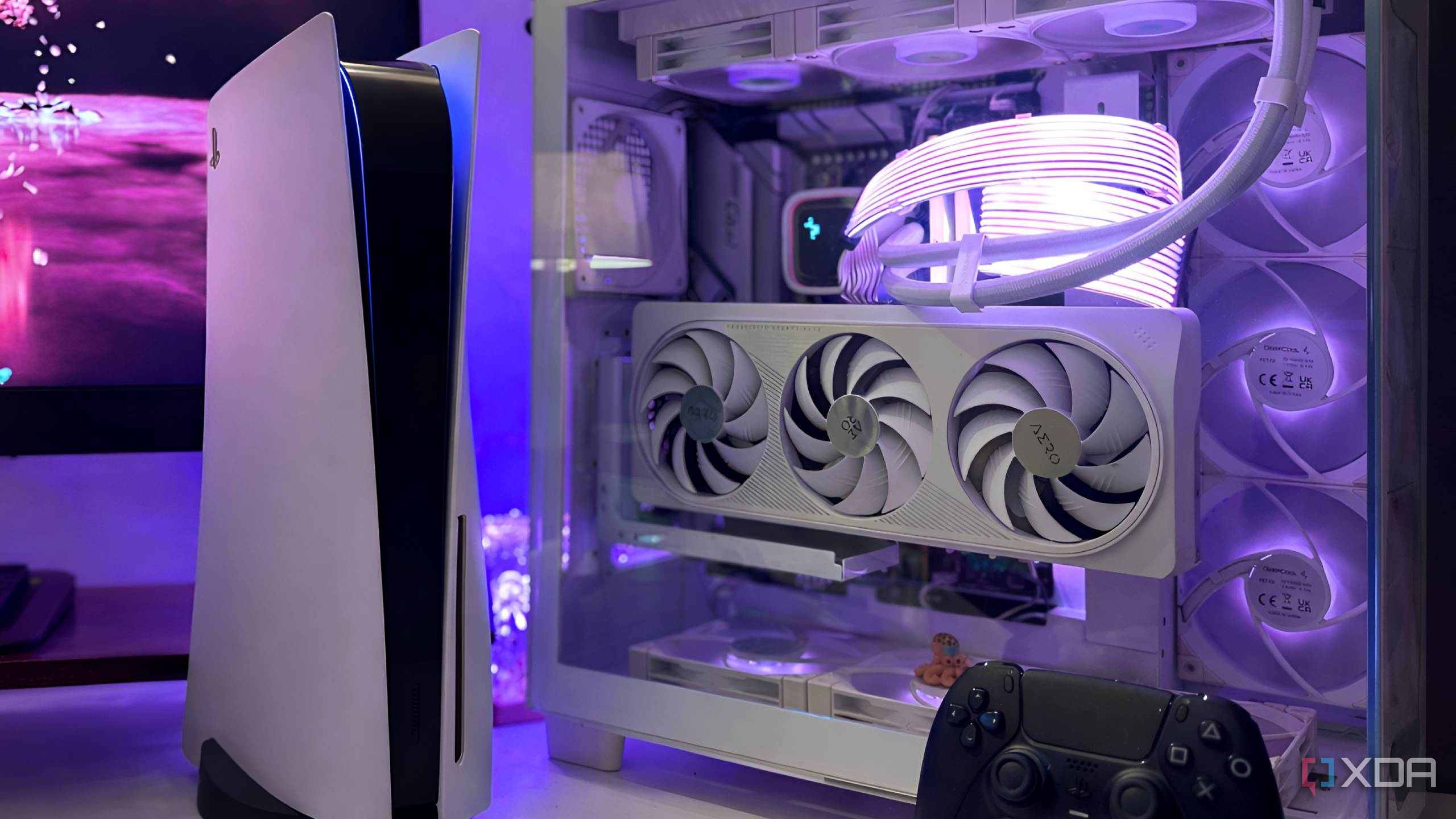 A PS5 next to a gaming PC.