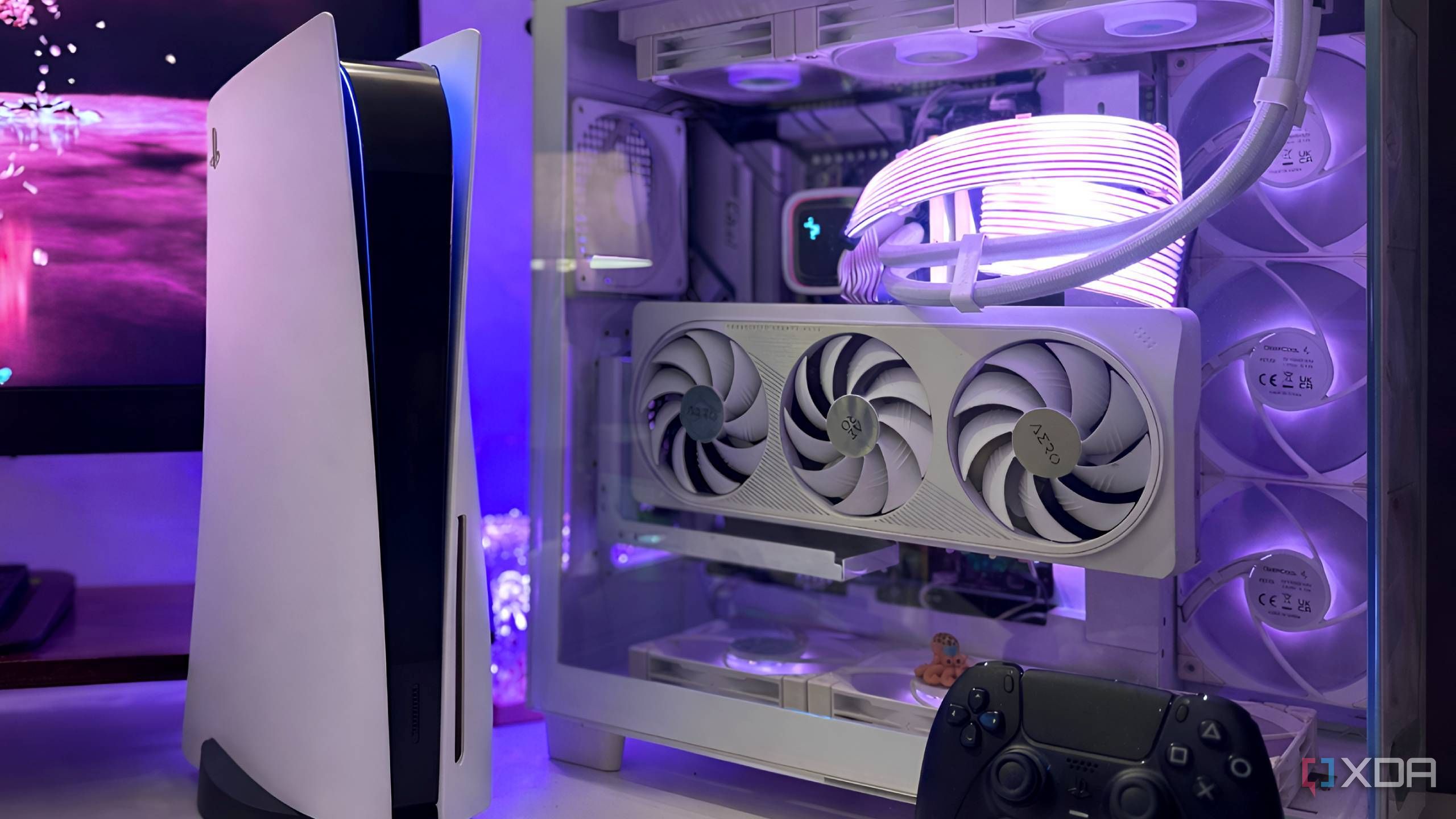 A Playstation 5 next to a custom gaming PC.