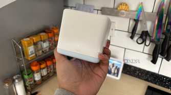 Mercusys mesh wifi system node in kitchen with kitchen counter in background