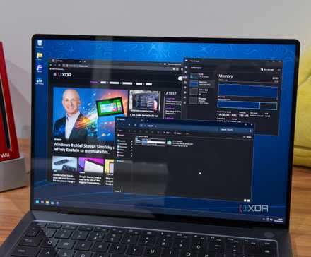 A laptop with 2GB of RAM running Windows 11 and showing a web browser and File Explorer