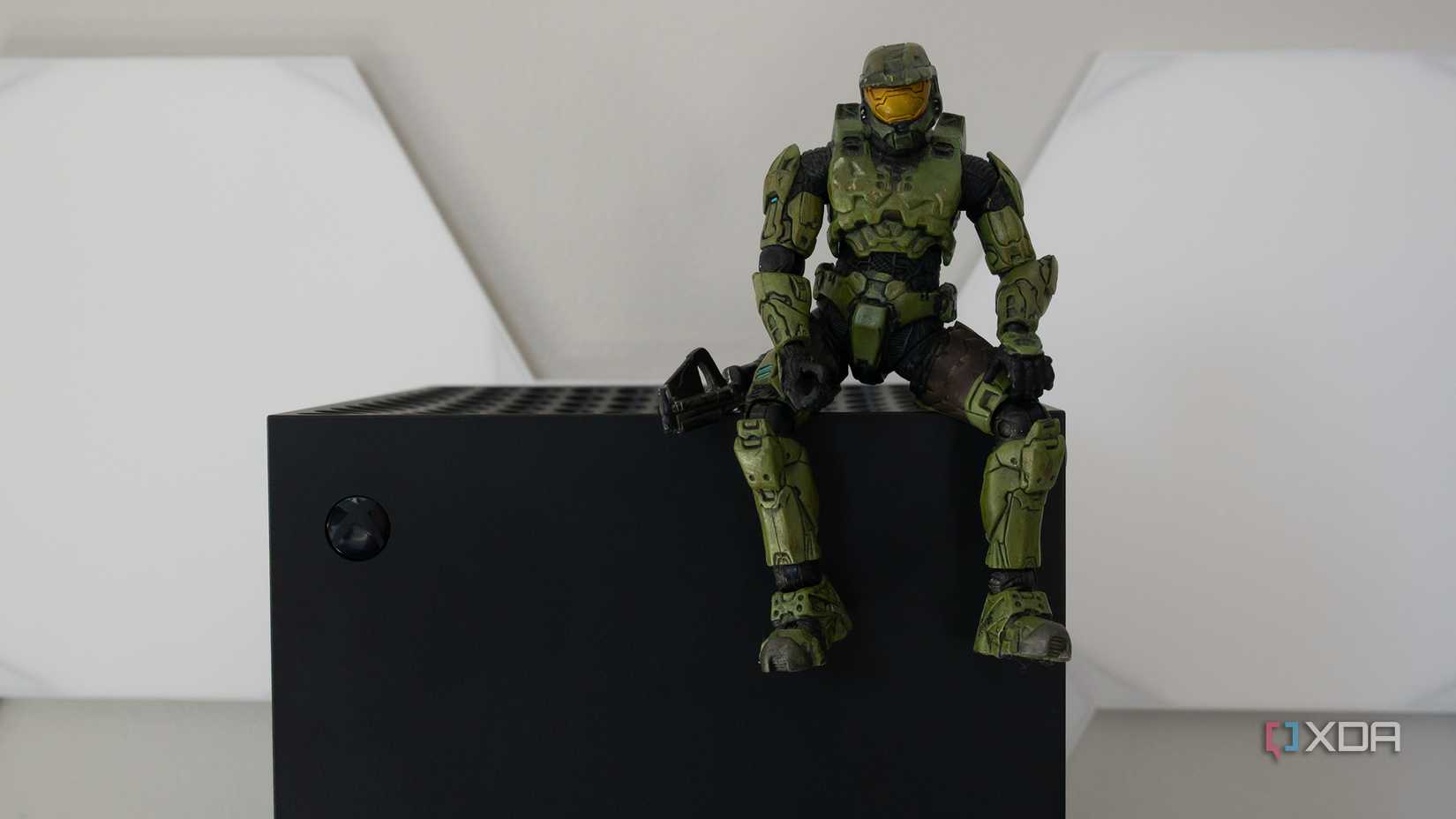An Xbox Series X with the Master Chief sitting on it