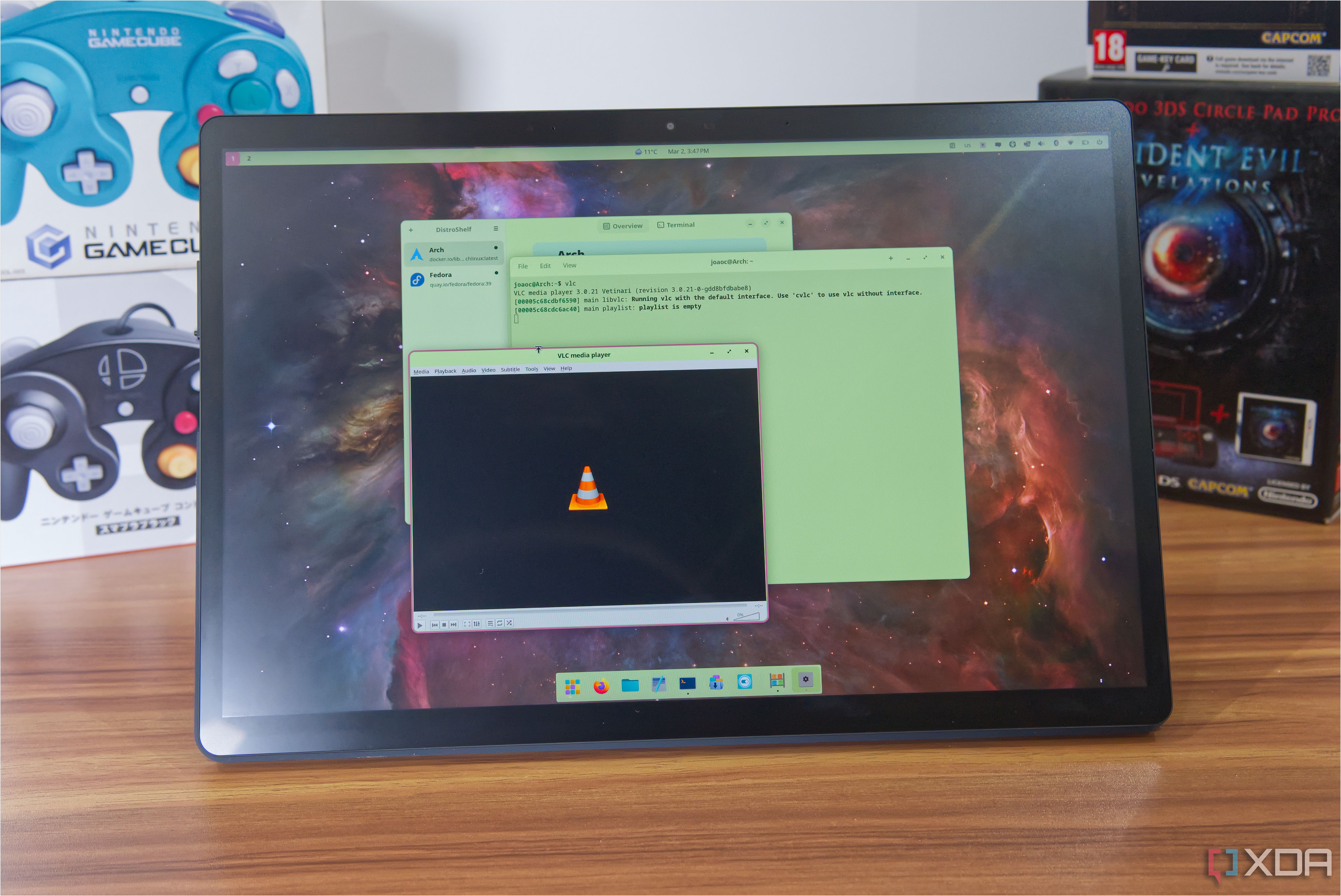 A tablet running Pop OS with Distrobox being used to run the Arch version of VLC media player
