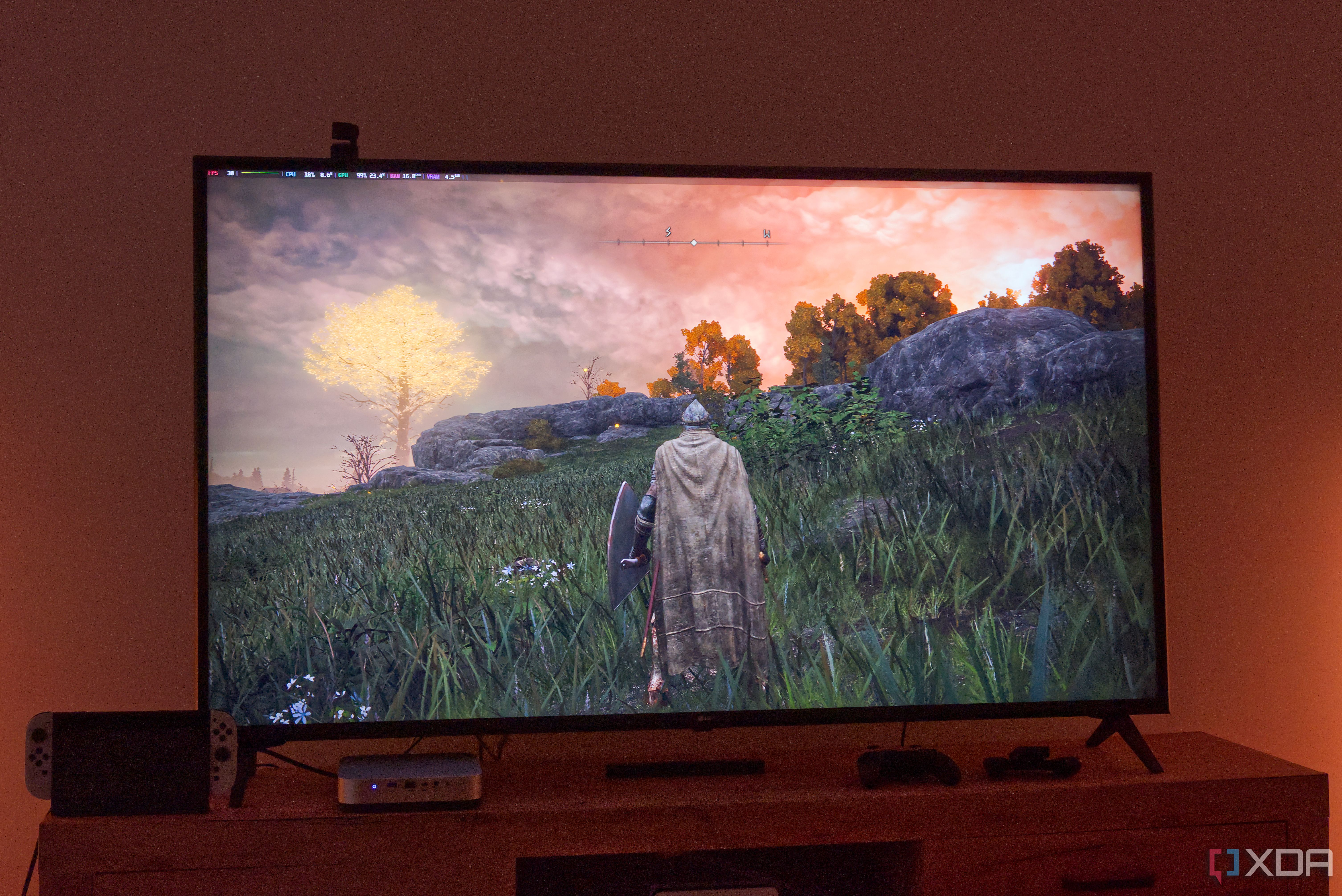 A TV displaying Elden Ring running on Bazzite with a performance overlay in the top left corner