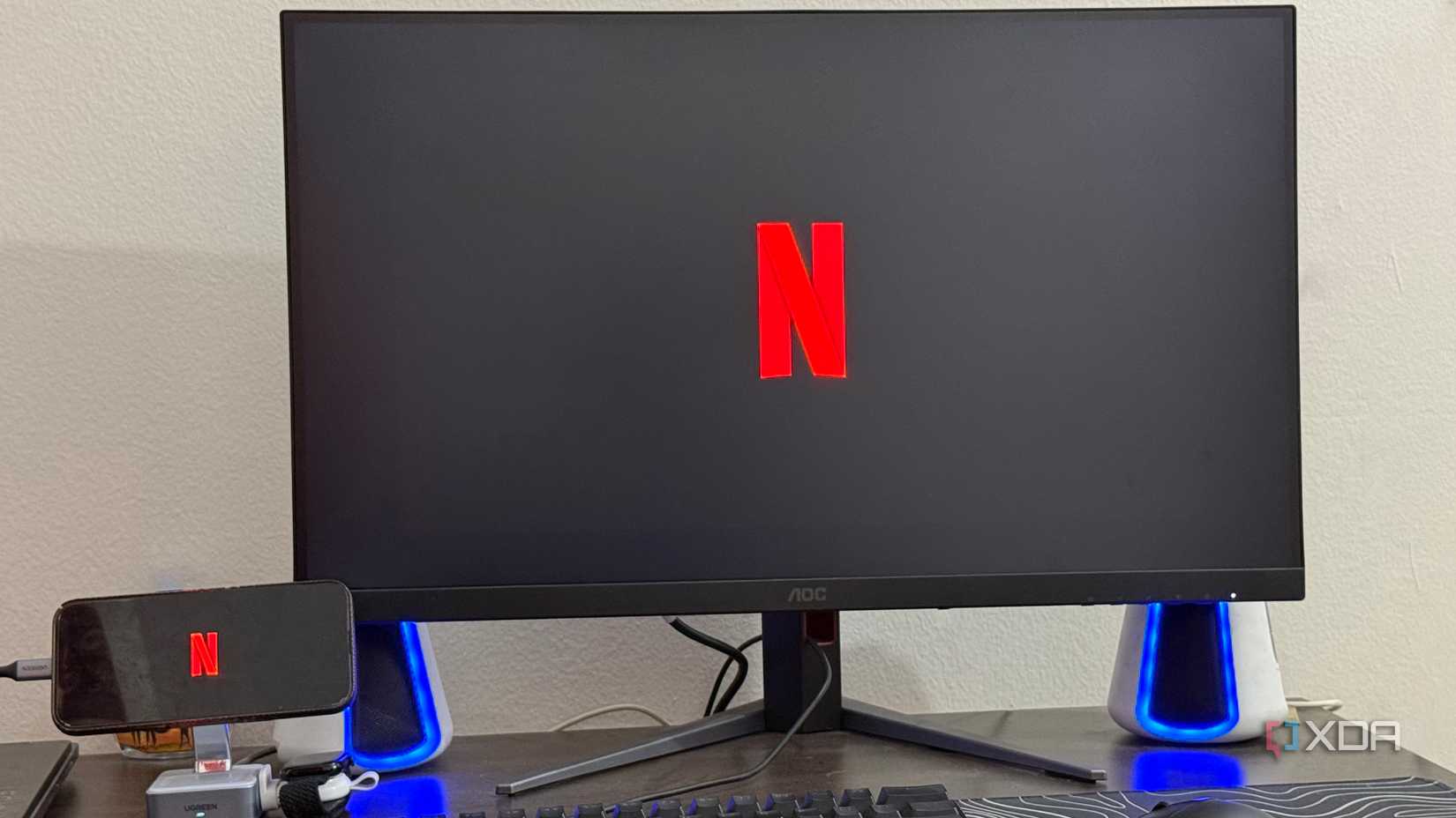 An iPhone with an external display connected to Netflix