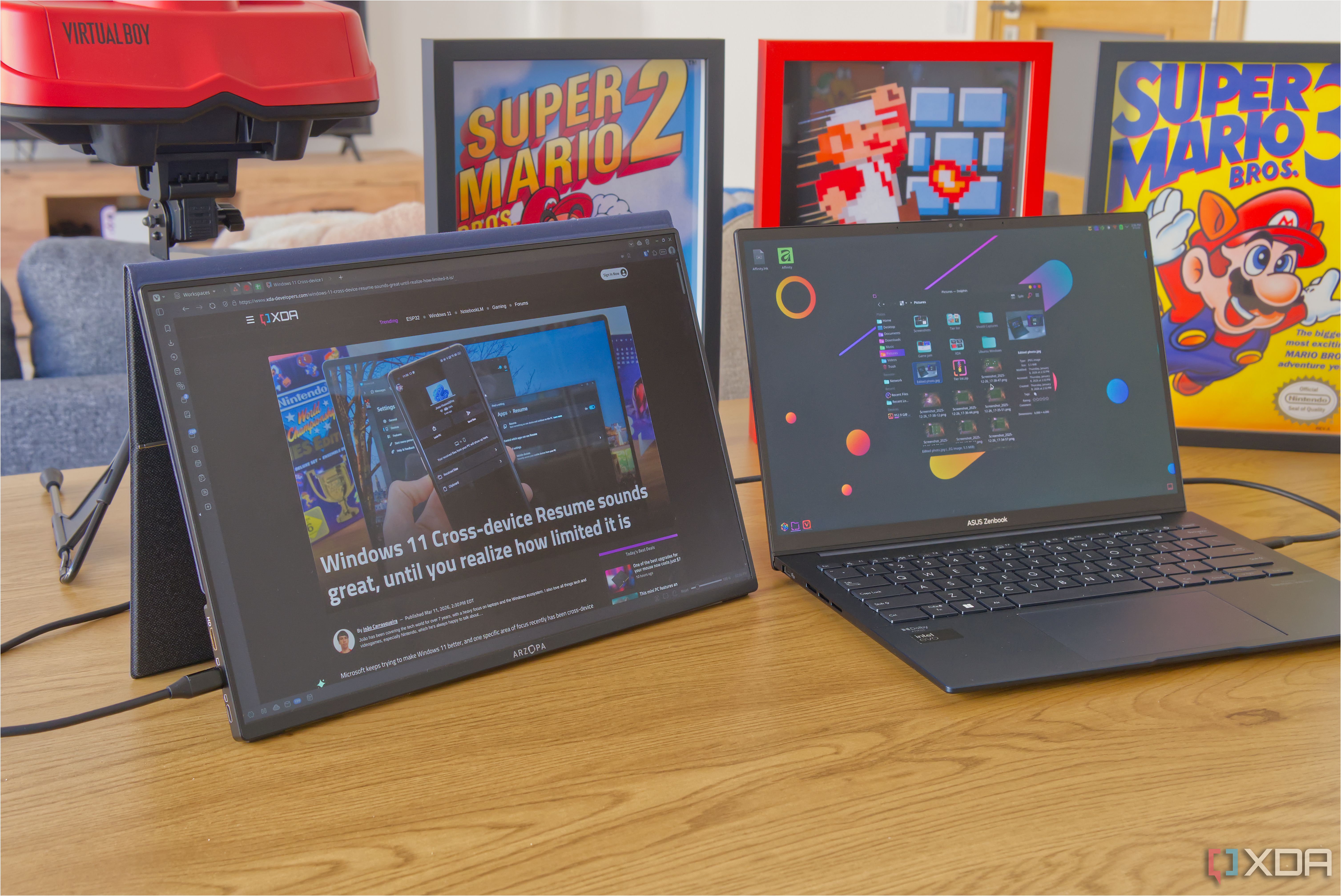 A laptop next to a portable monitor