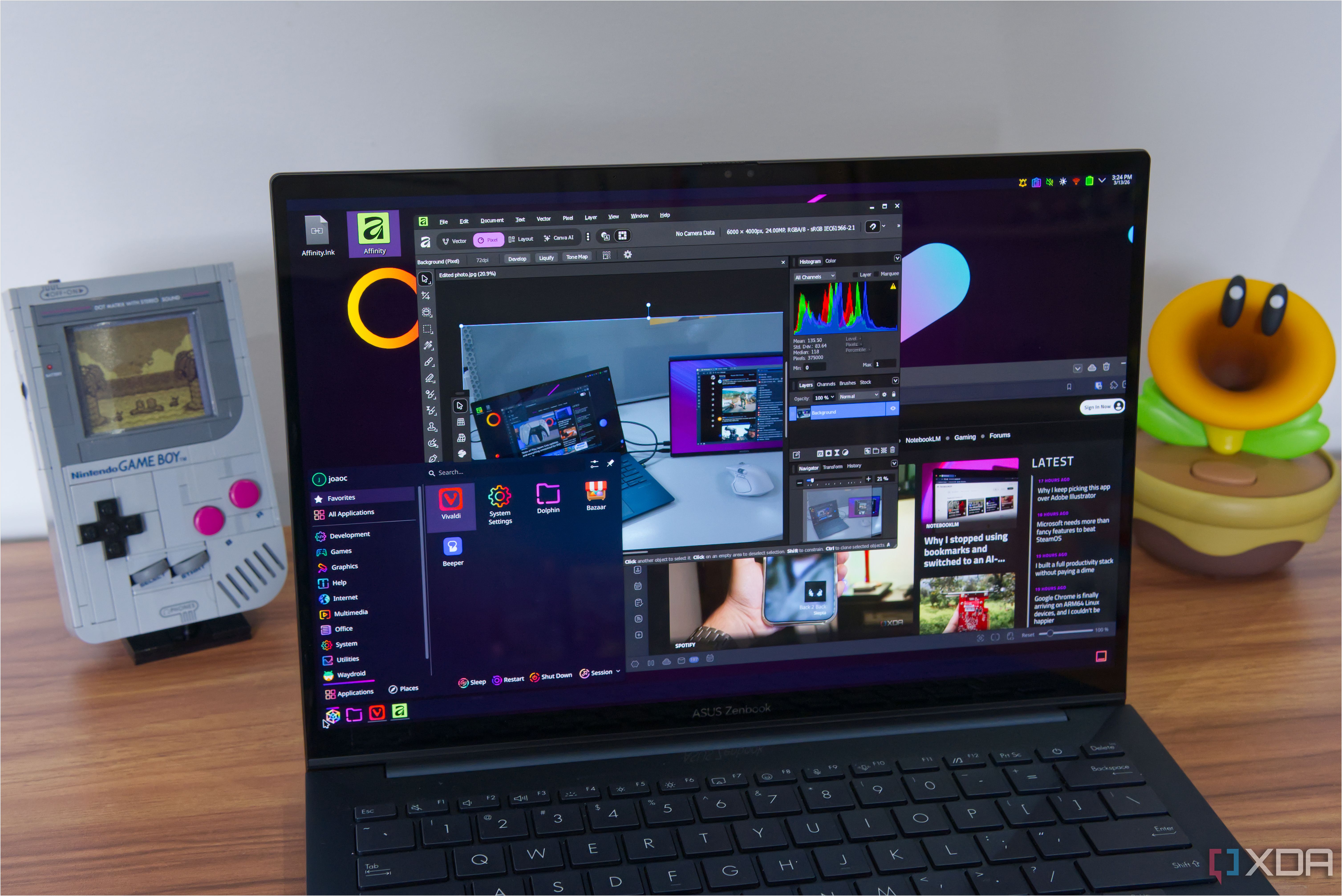 A laptop shwoing the KDE Plasma desktop with apps including Affinity and Vivaldi open