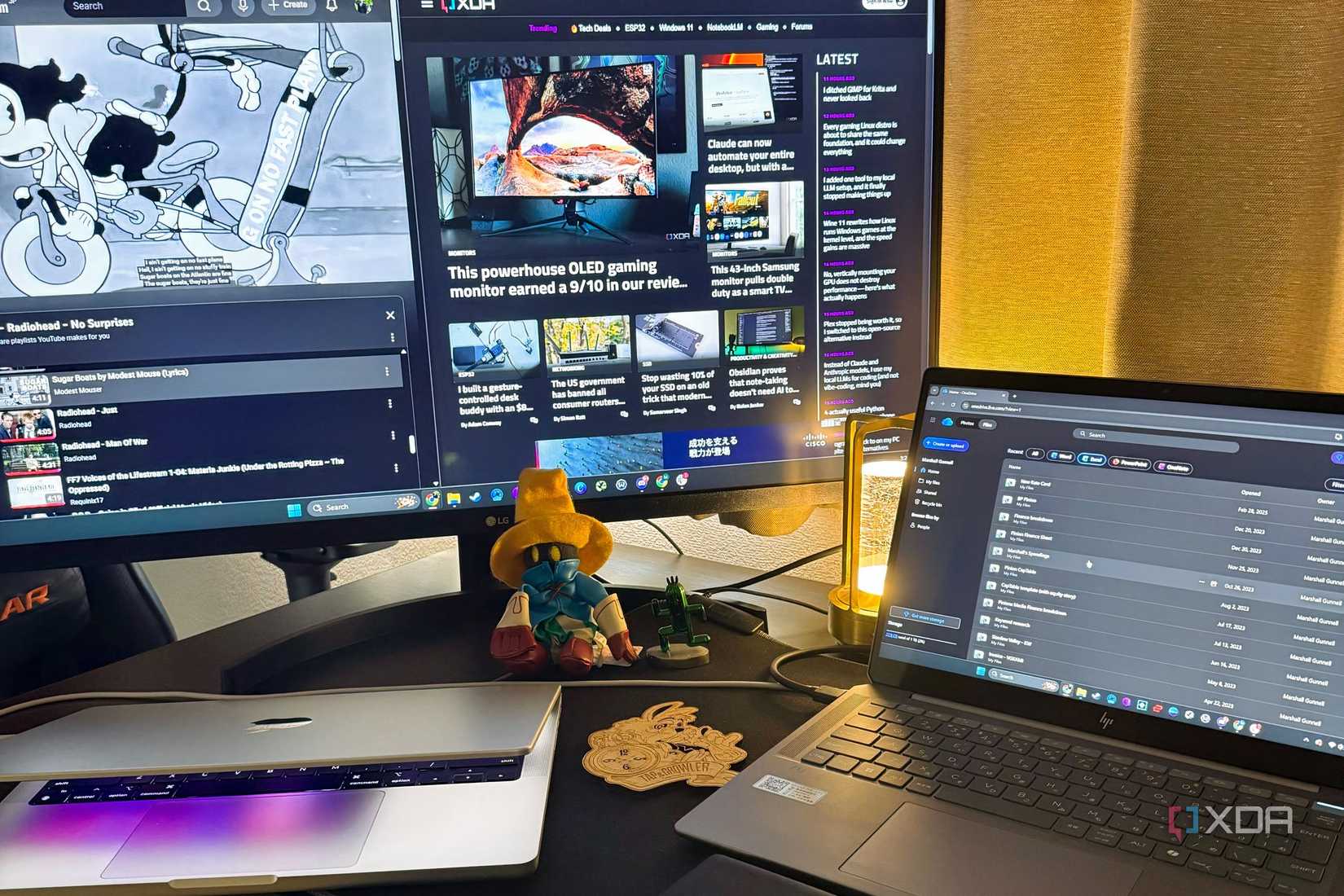 OneDrive on a laptop with XDA in the background