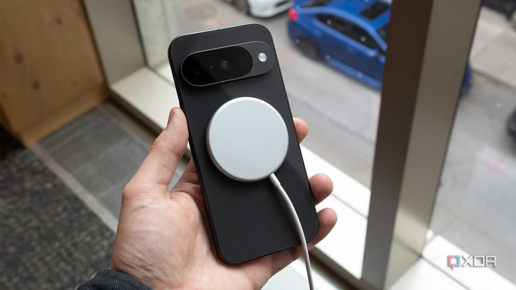 The Pixel 10 with a PixelSnap charger on it