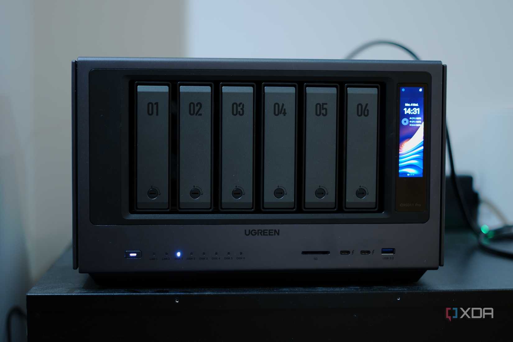 Ugreen iDX 6011 Pro full front showing screen, ports, and drive bays