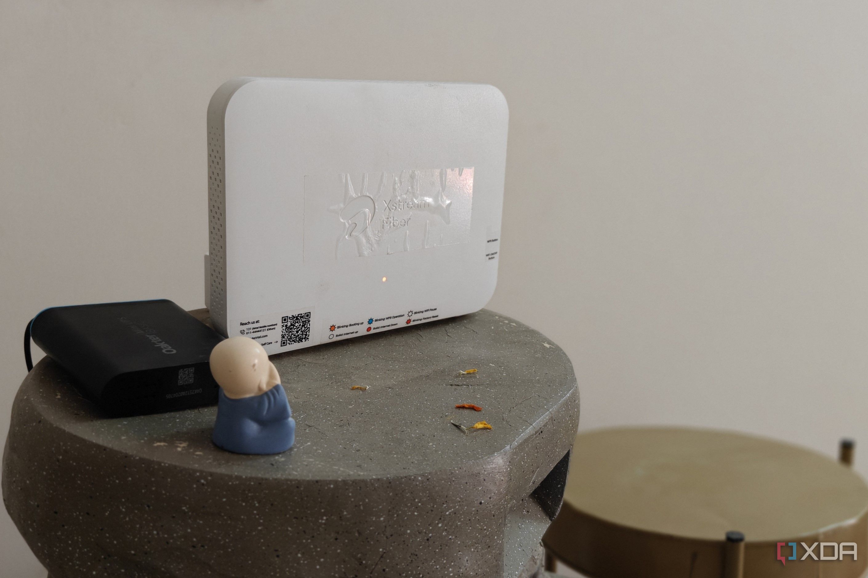 A white Wi-Fi 6 router on a grey surface