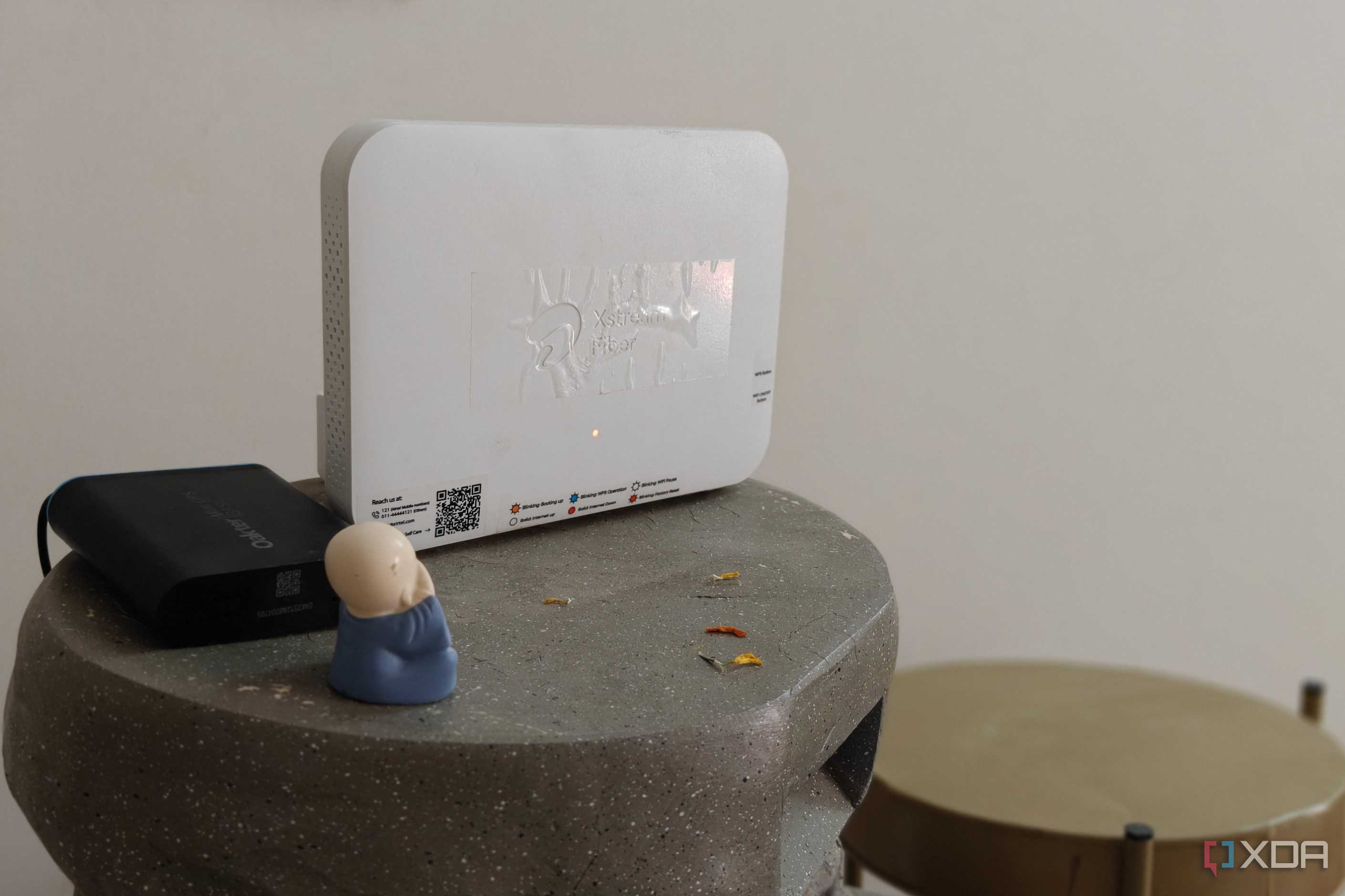 A white Wi-Fi 6 router on a grey surface