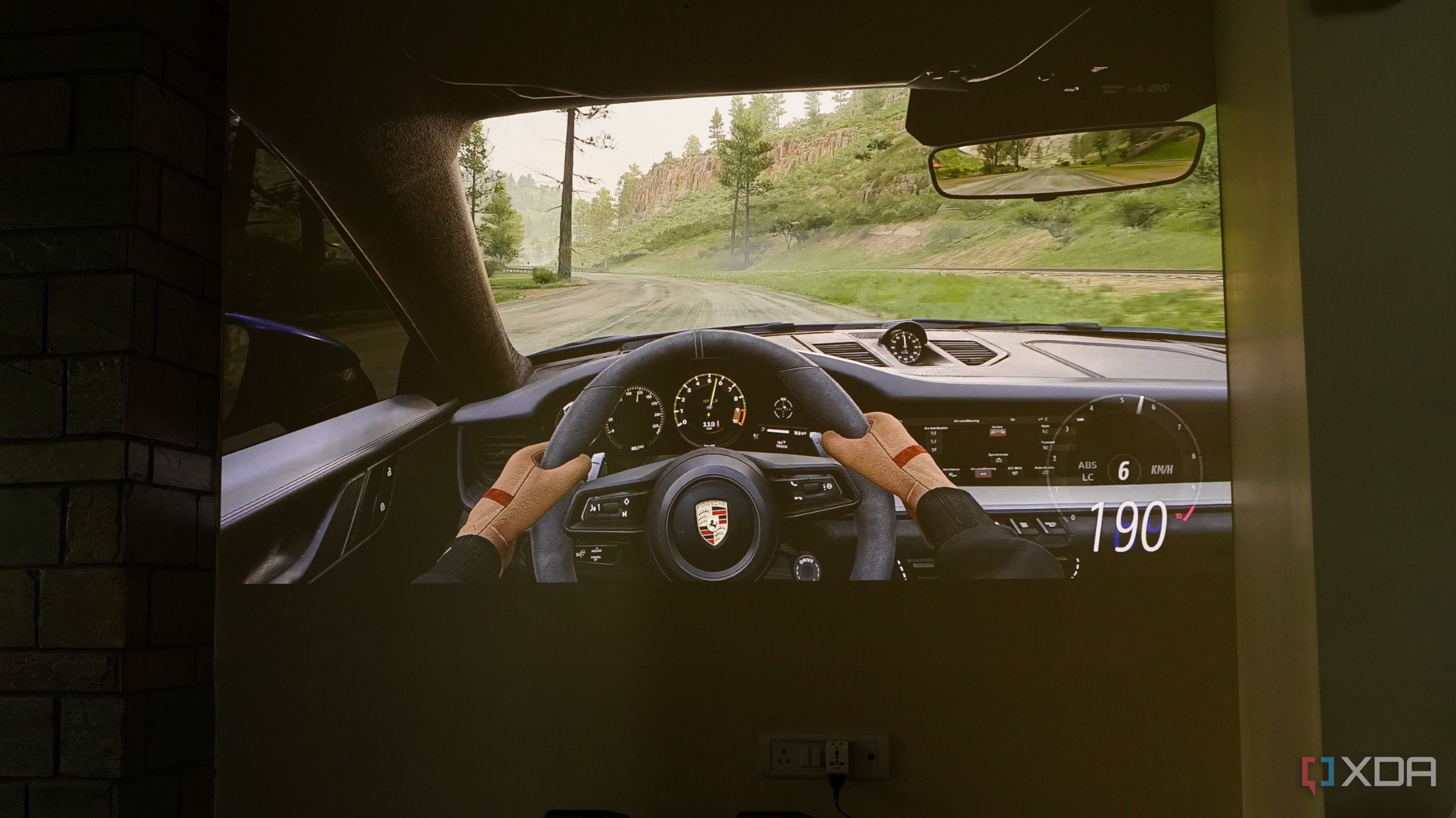 Forza Horizon 5 gameplay on a projector screen