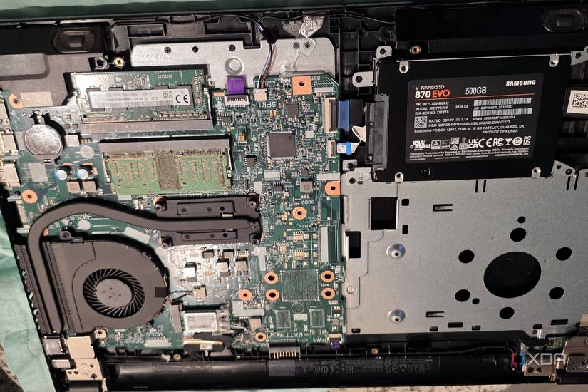 Behind a laptop motherboard with SATA SSD