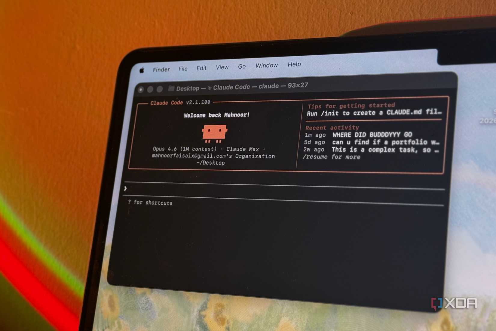 A claude code terminal window showing a welcome message and recent activity on a Mac laptop
