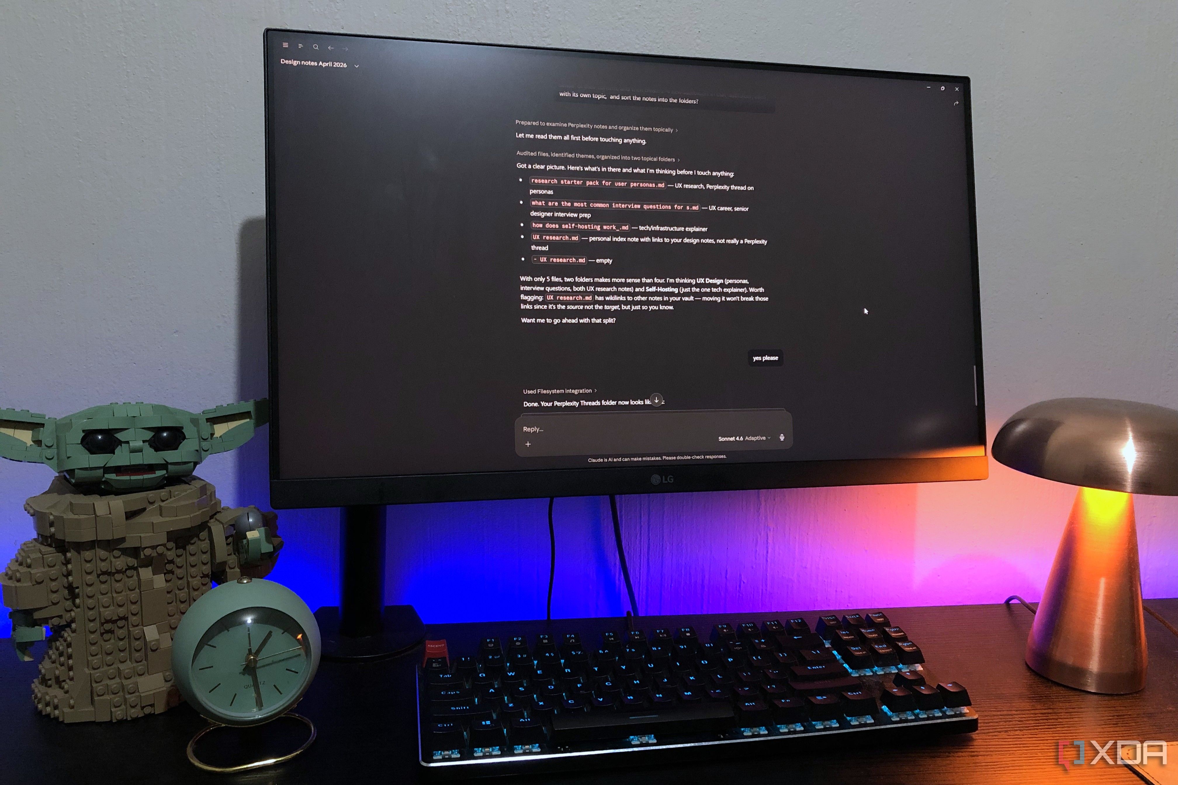 Claude logged into Obsidian on a desktop PC, lamp and Lego in view