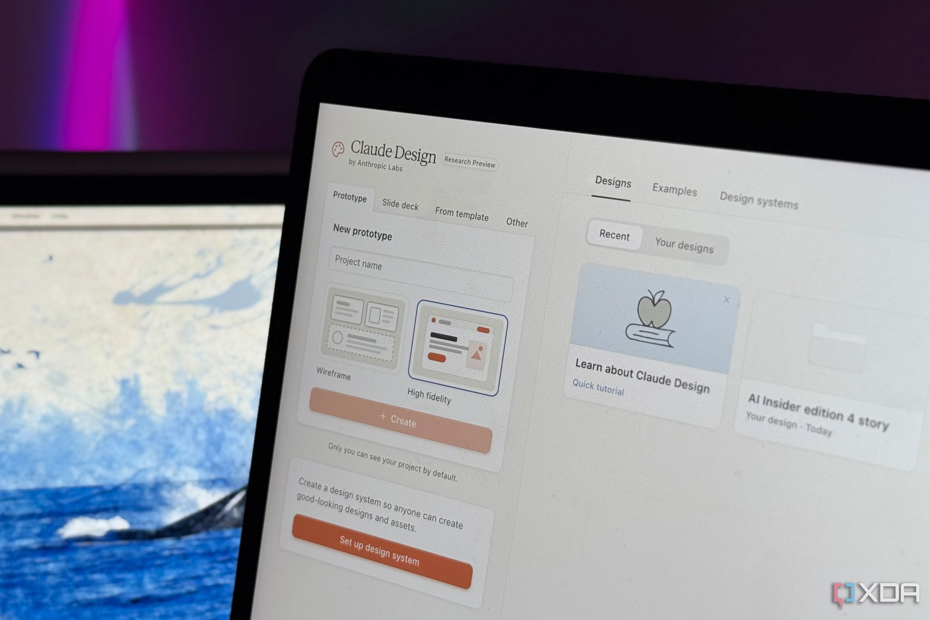 claude design website displayed on computer monitor with purple lighting in background