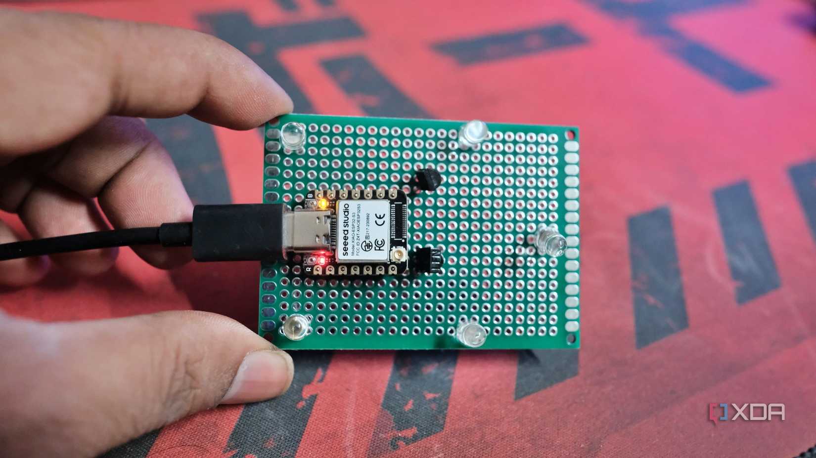 Photo of the IR Transmitter LEDs, IR Receiver, NPN Transistor and ESP32 on the prototype board