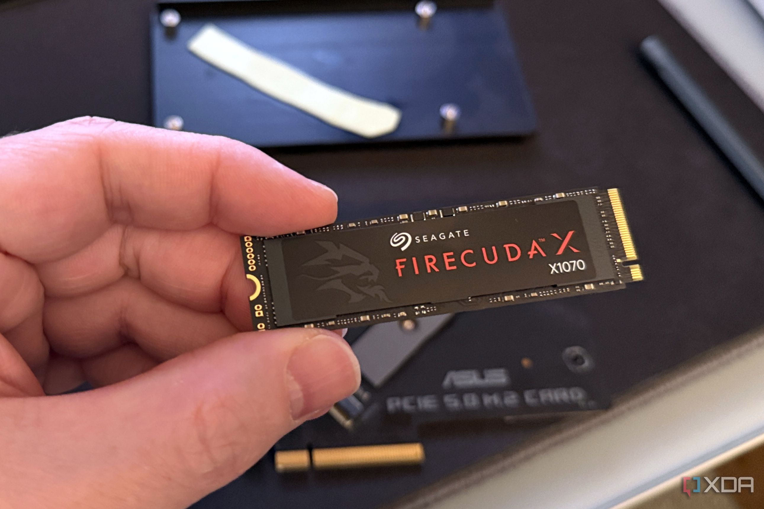 firecuda x1070 ssd held in hand