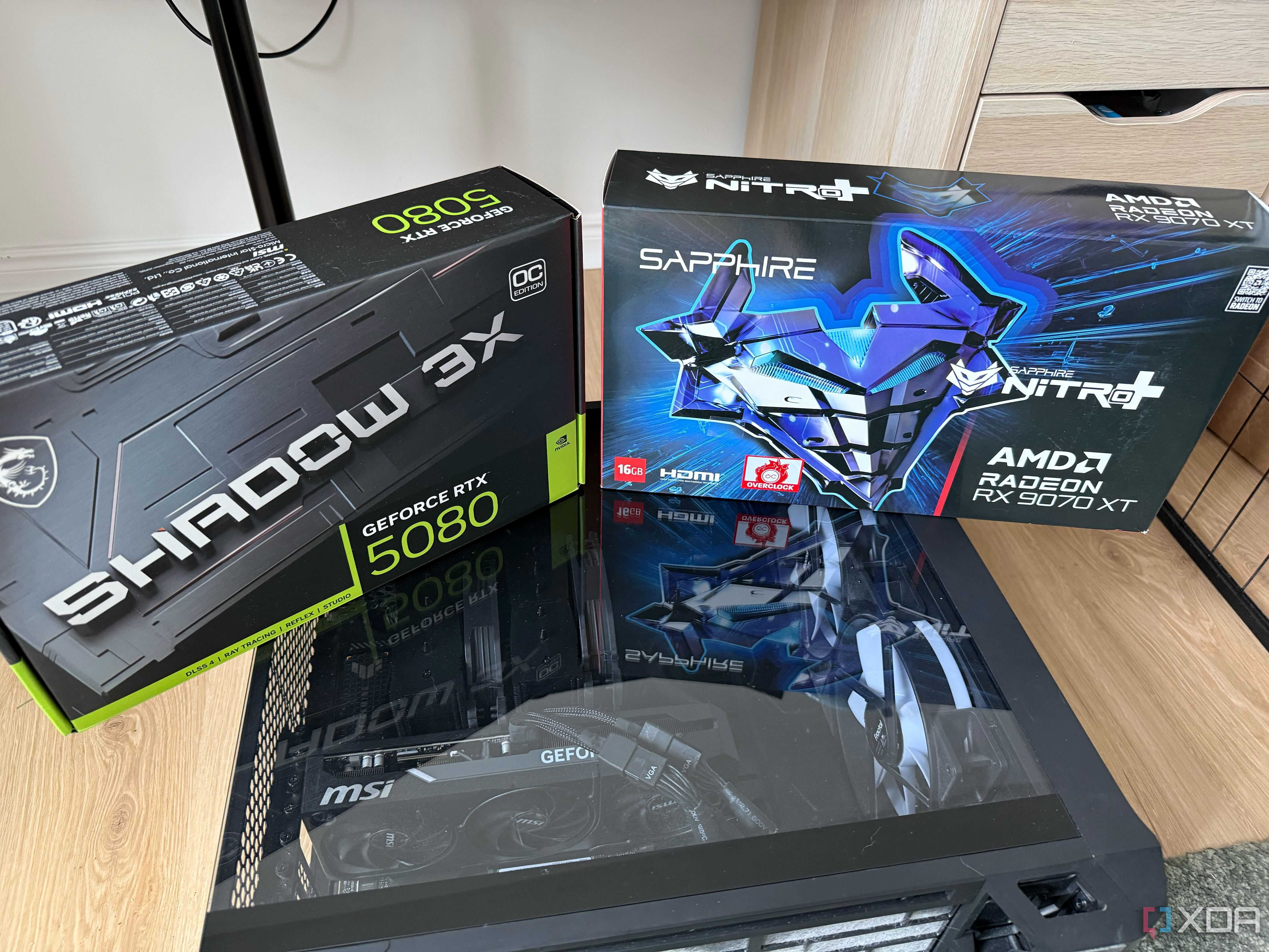 A photo of two GPU boxes on top of a PC build