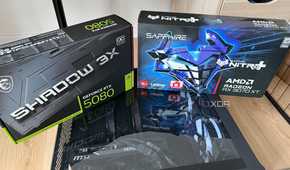 A photo of two GPU boxes on top of a PC build