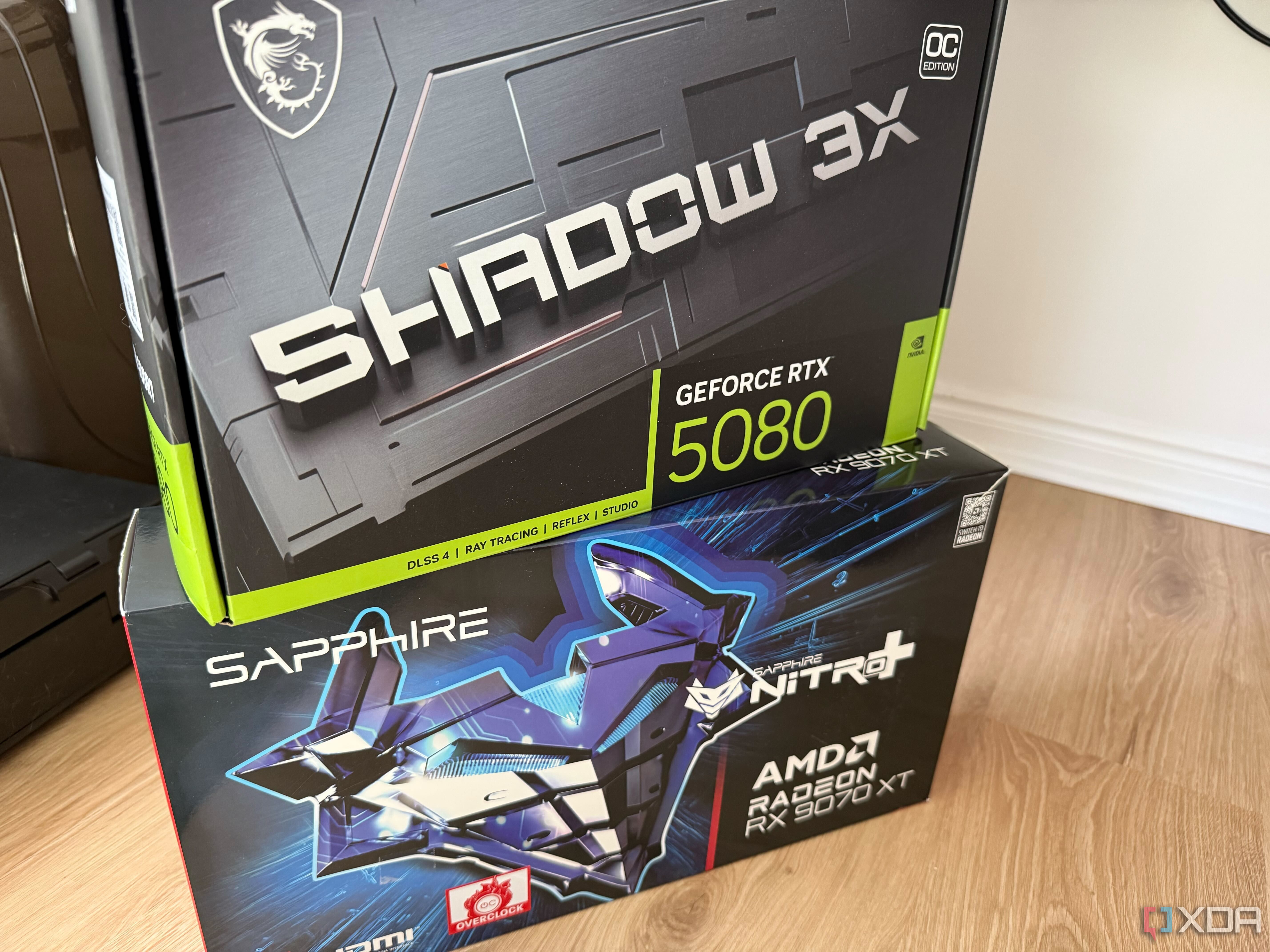 A photo of two graphics card boxes stacked on top of each other