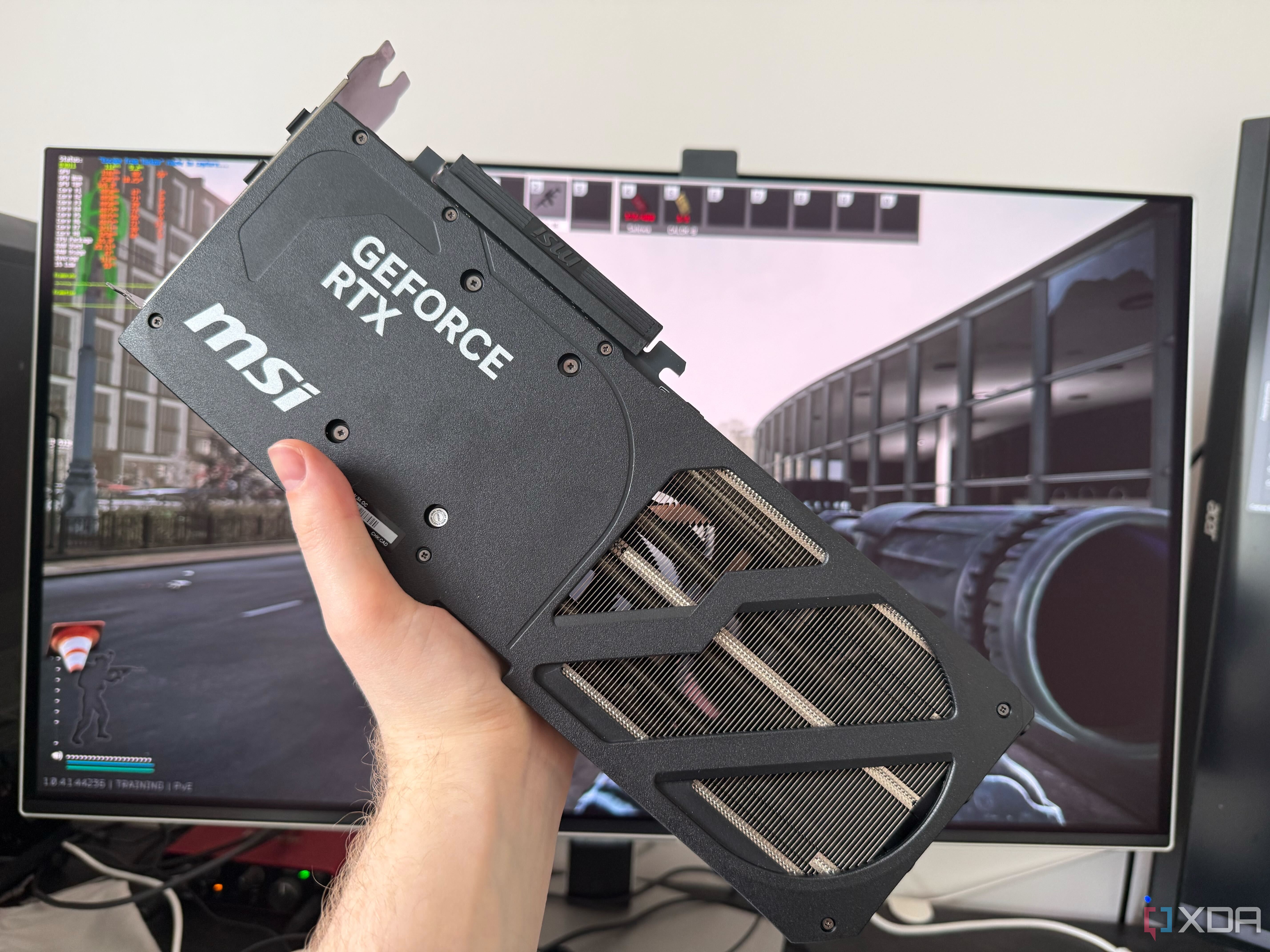A photo of someone holding a graphics card