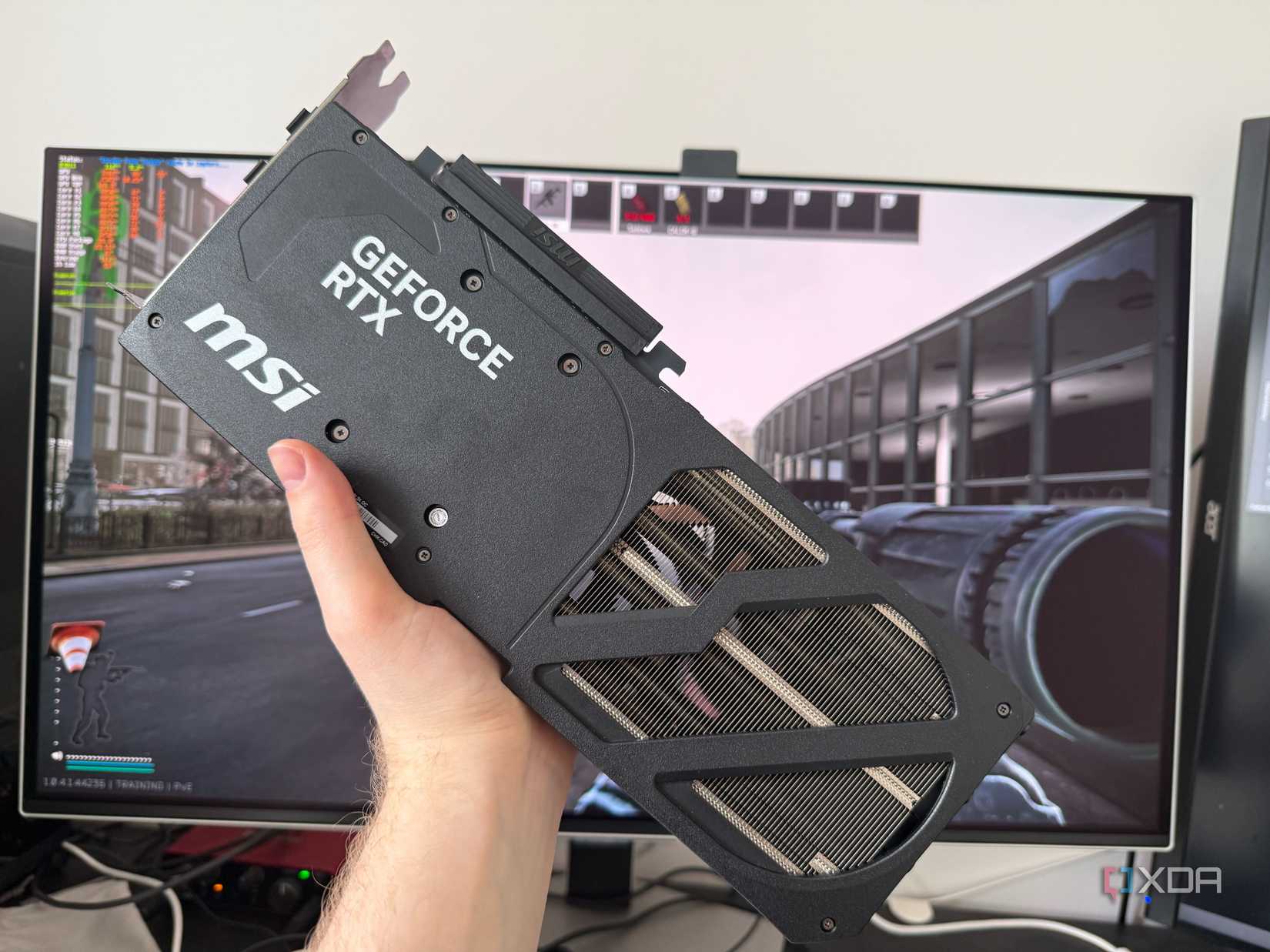 Picture of someone holding a graphics card