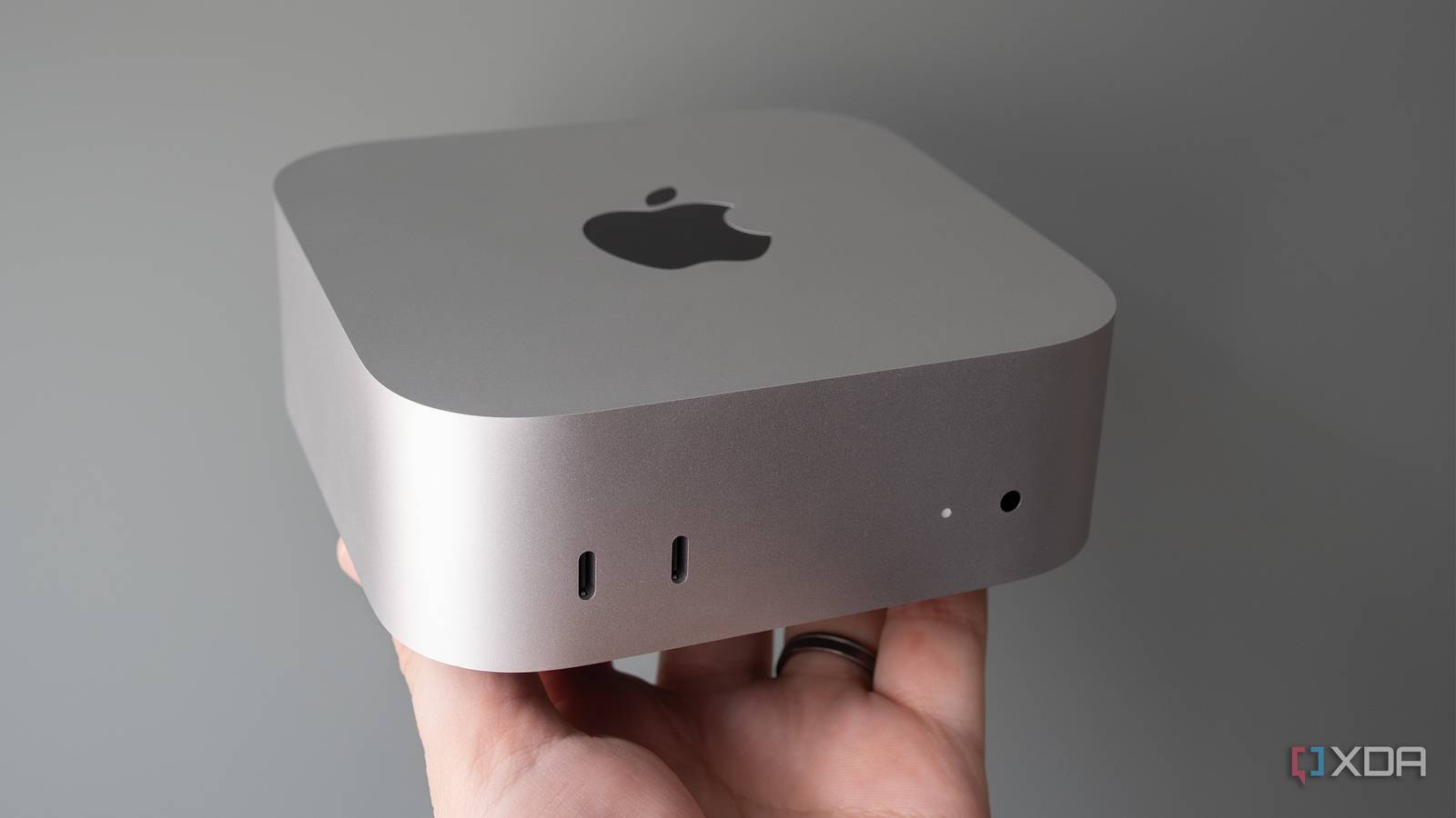Holding the M4 Mac mini 