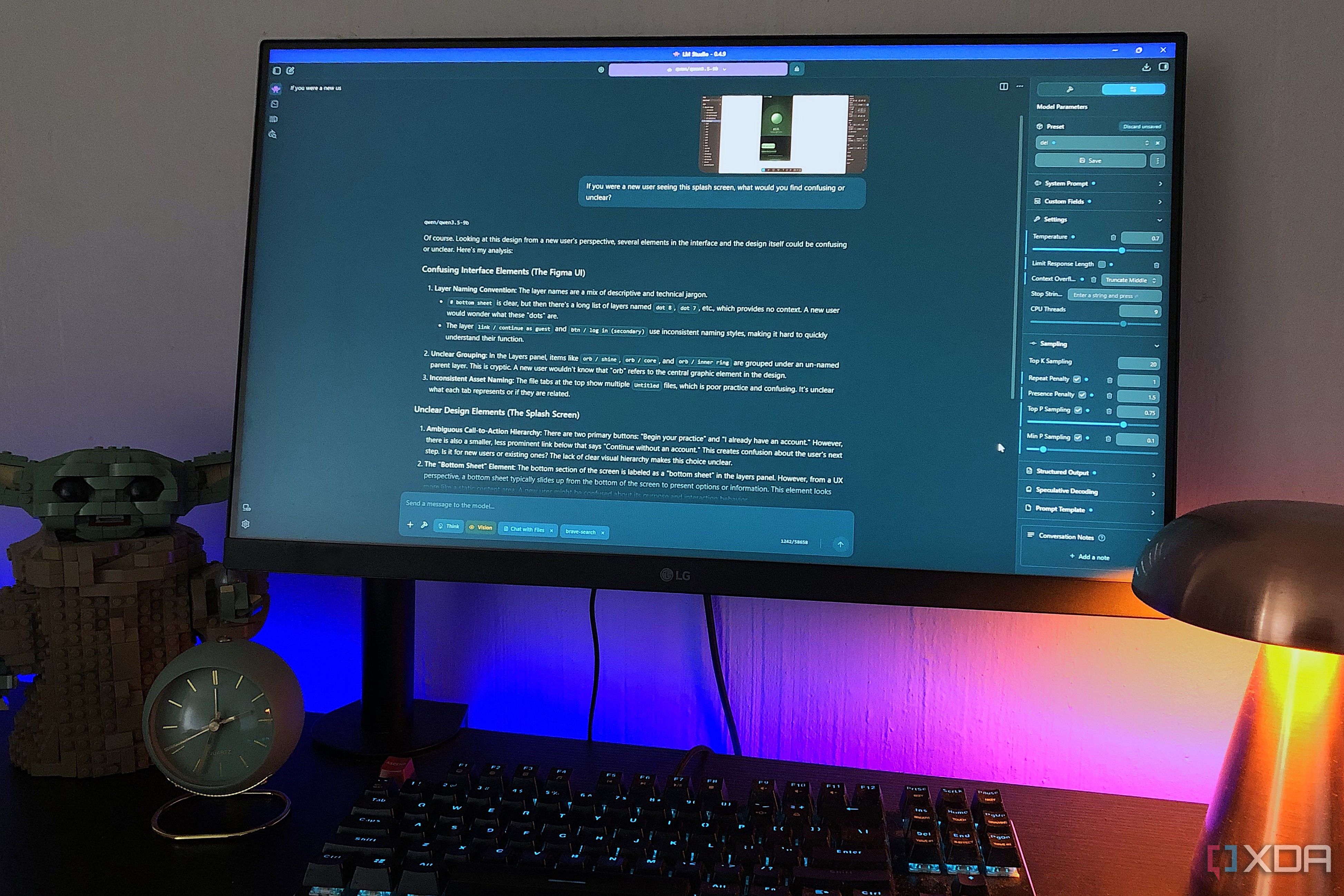prompting qwen in lm studio on a desktop computer, lamp and lego in view